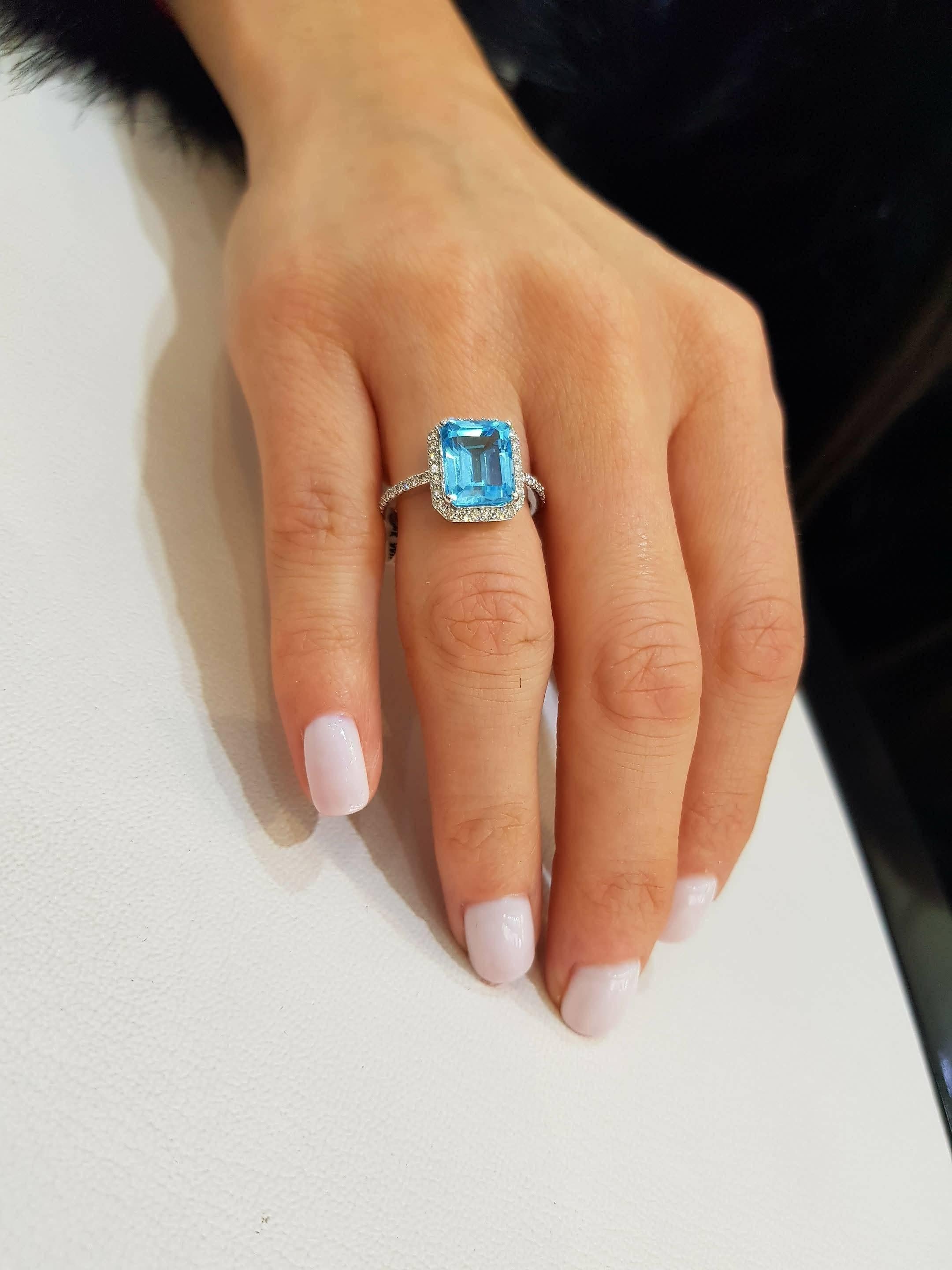 Modern 5.00ct Emerald Cut Blue Topaz 0.38 Carat Diamond Halo 18 Karat White Gold Ring