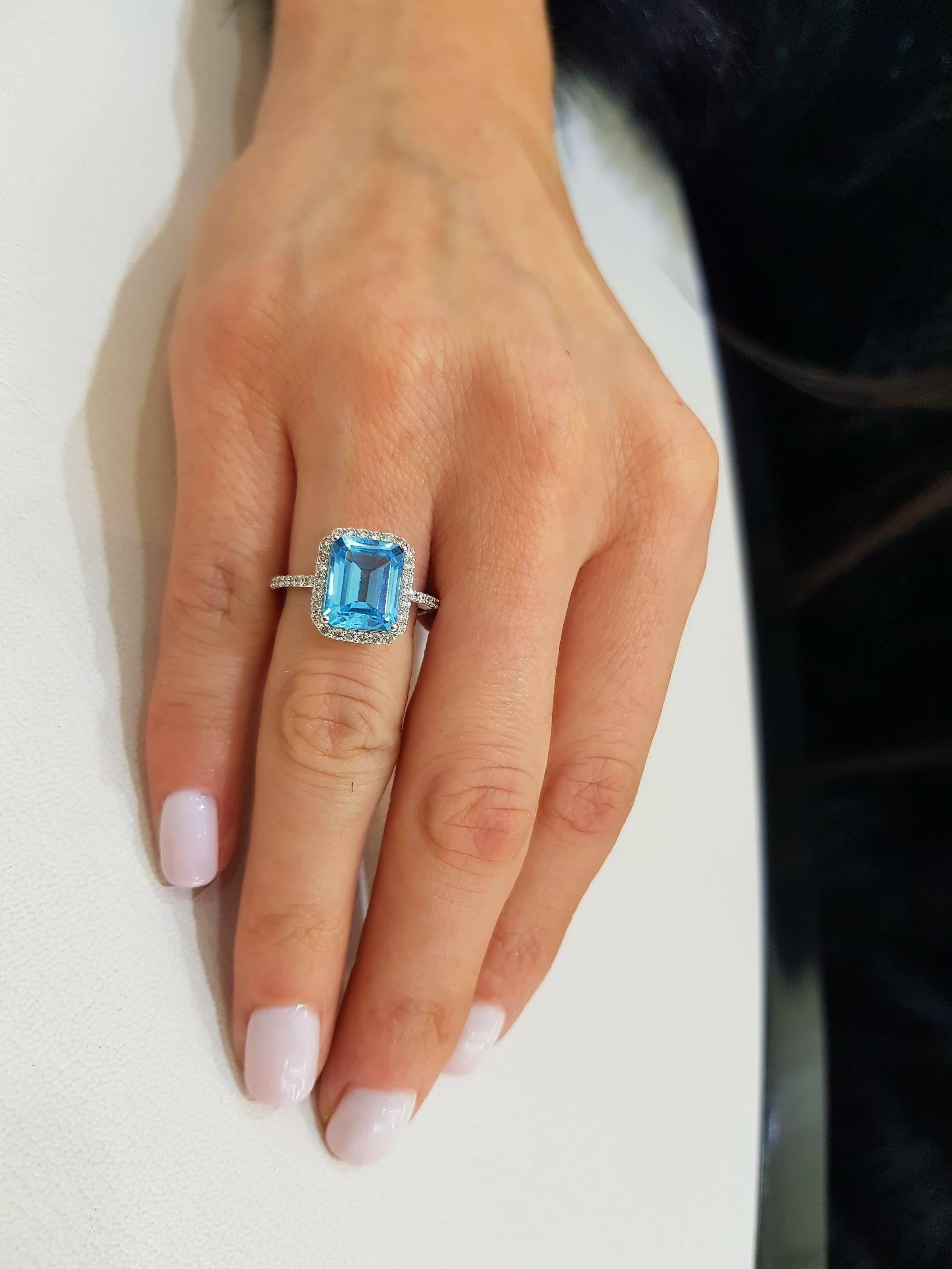 5.00ct Emerald Cut Blue Topaz 0.38 Carat Diamond Halo 18 Karat White Gold Ring In New Condition For Sale In London, GB