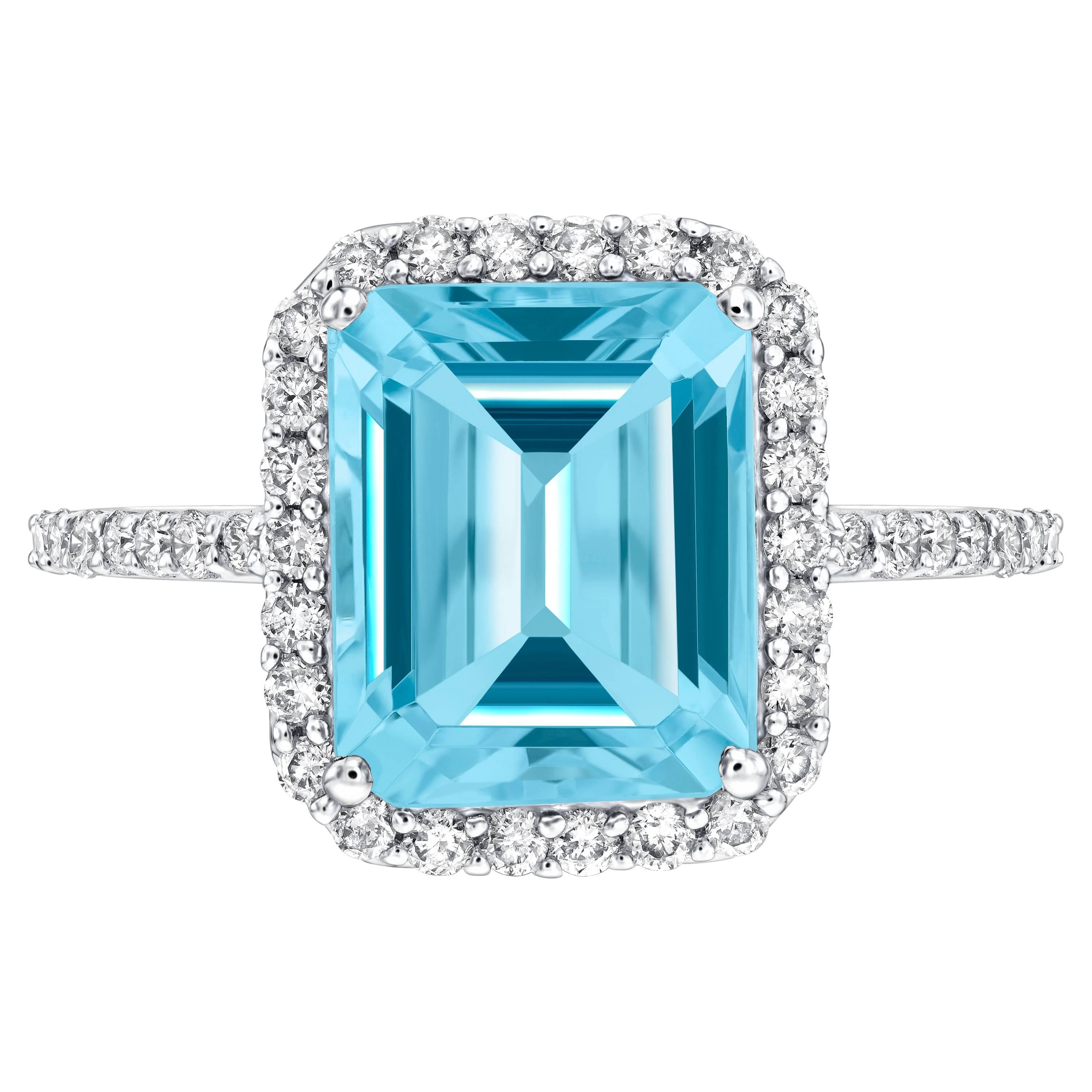 5.00ct Emerald Cut Blue Topaz 0.38 Carat Diamond Halo 18 Karat White Gold Ring