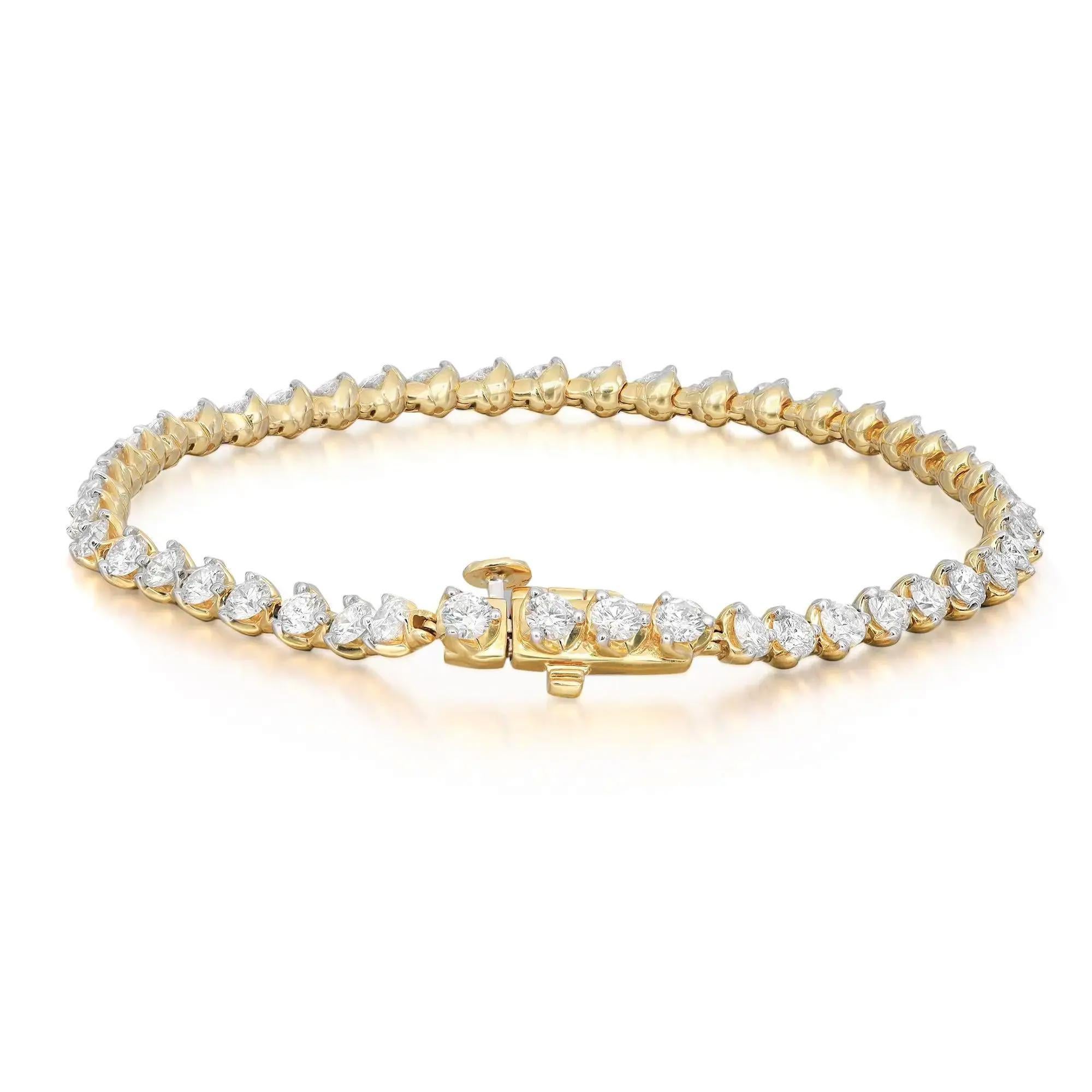 This exquisite Rachael Koen tennis bracelet features round brilliant cut diamonds in three prong setting style crafted in 14k yellow gold. Feminine and super wearable handmade modern creation is a great addition to your jewelry collection. This