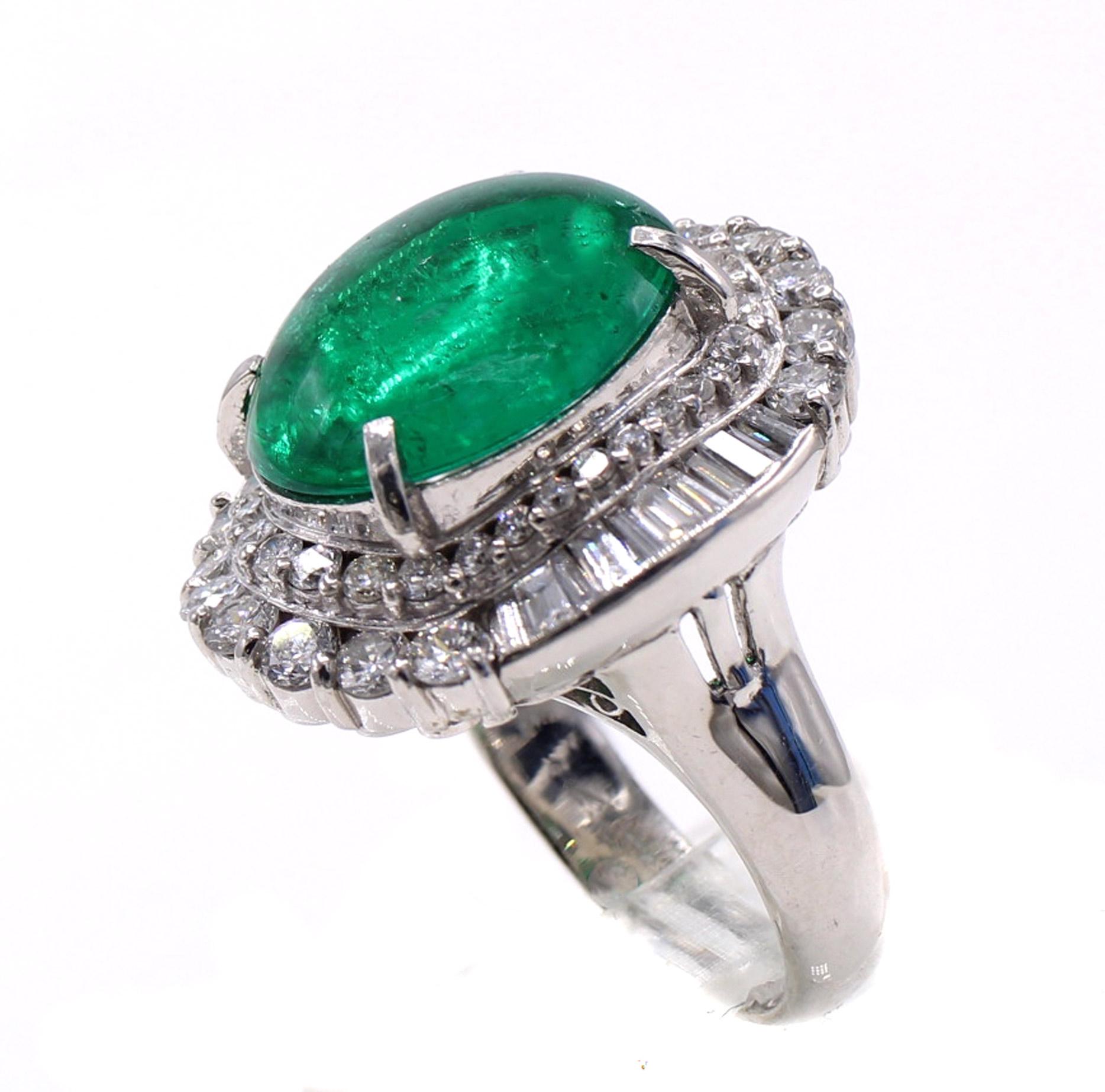 Beautifully designed and masterfully handcrafted platinum emerald diamond cocktail ring featuring a Colombian cabochon emerald weighing 5.01 carats. The perfectly cut cabochon displays a strongly saturated forest green and is embellished by bright