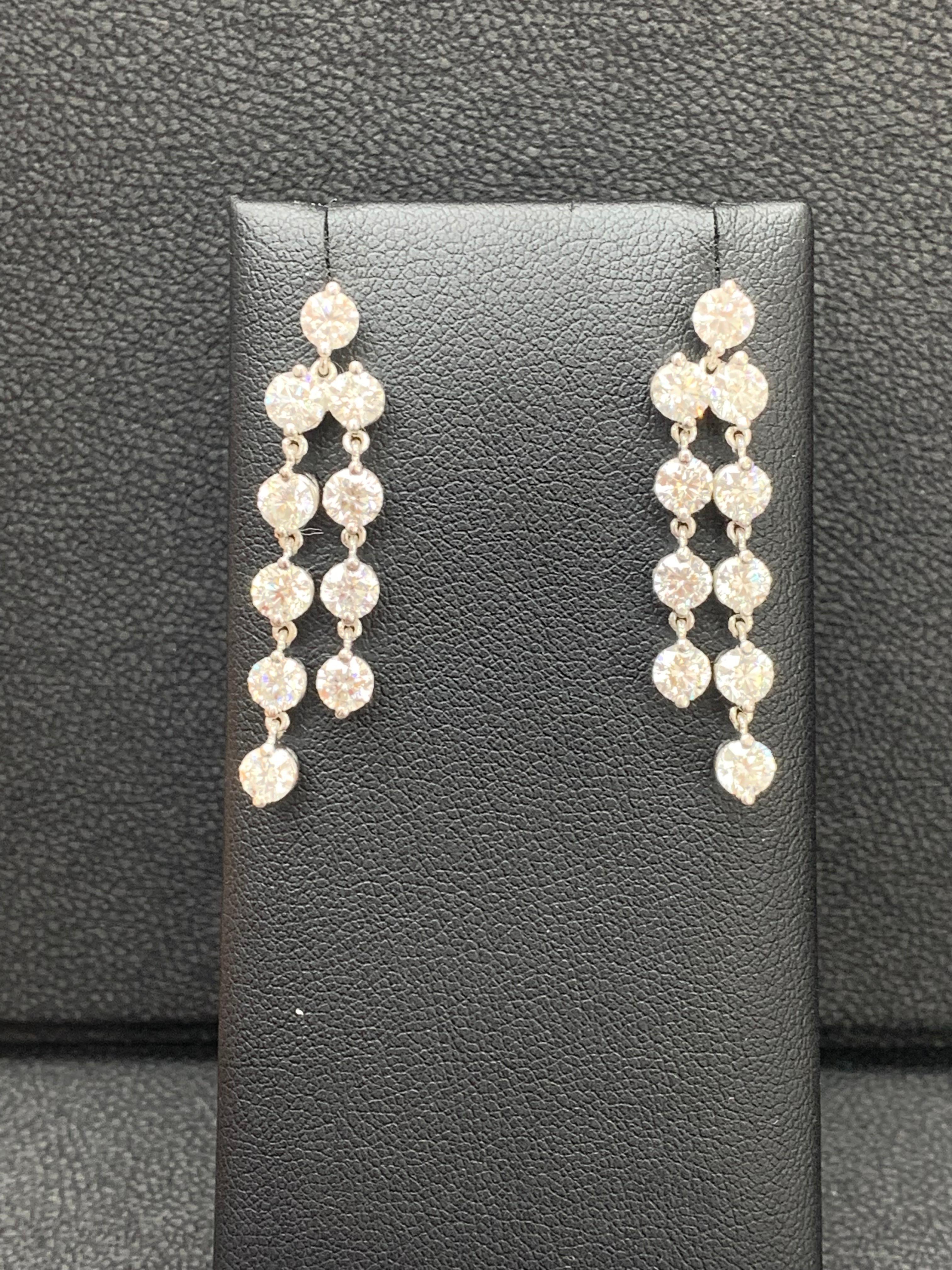 An important pair of dangle earrings showcasing two row of 5.01 carat round brilliant diamonds. 

Style available in different price ranges. Prices are based on your selection of the 4C’s (Carat, Color, Clarity, Cut). Please contact us for more