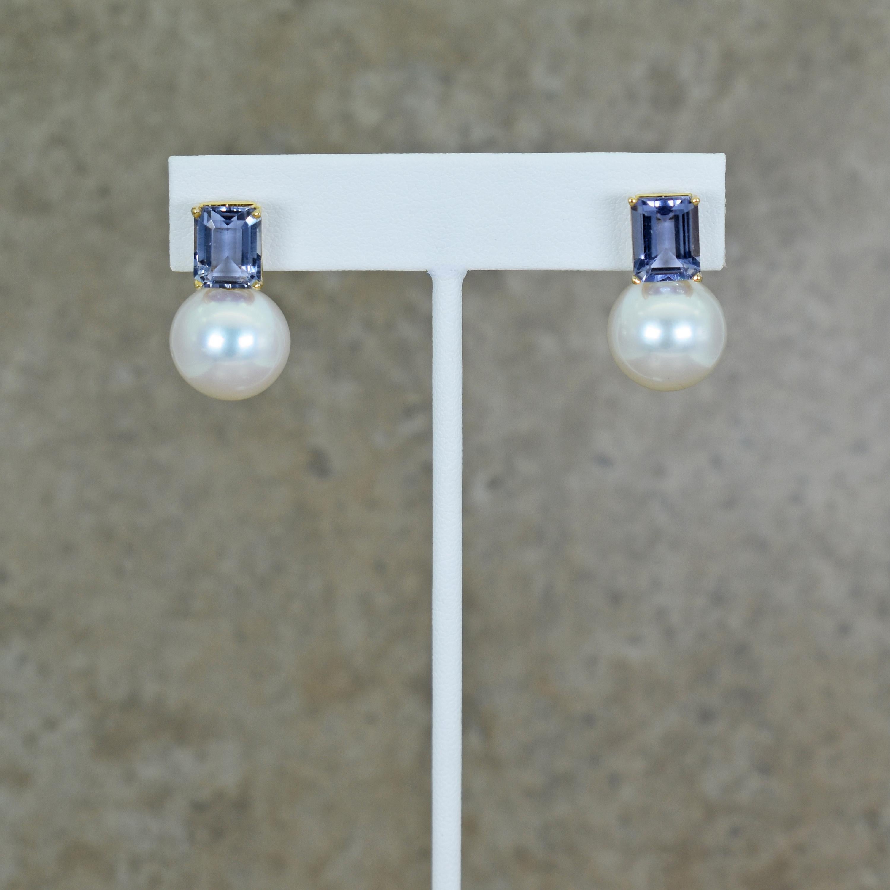 Emerald-cut 5.01 total carat Iolite and 15mm Freshwater Pearl 14k yellow gold drop stud earrings. Drop earrings are 1 inch in length. Gorgeous, light purplish-blue Iolite and beautiful Pearls in this contemporary yet timeless pair of earrings.