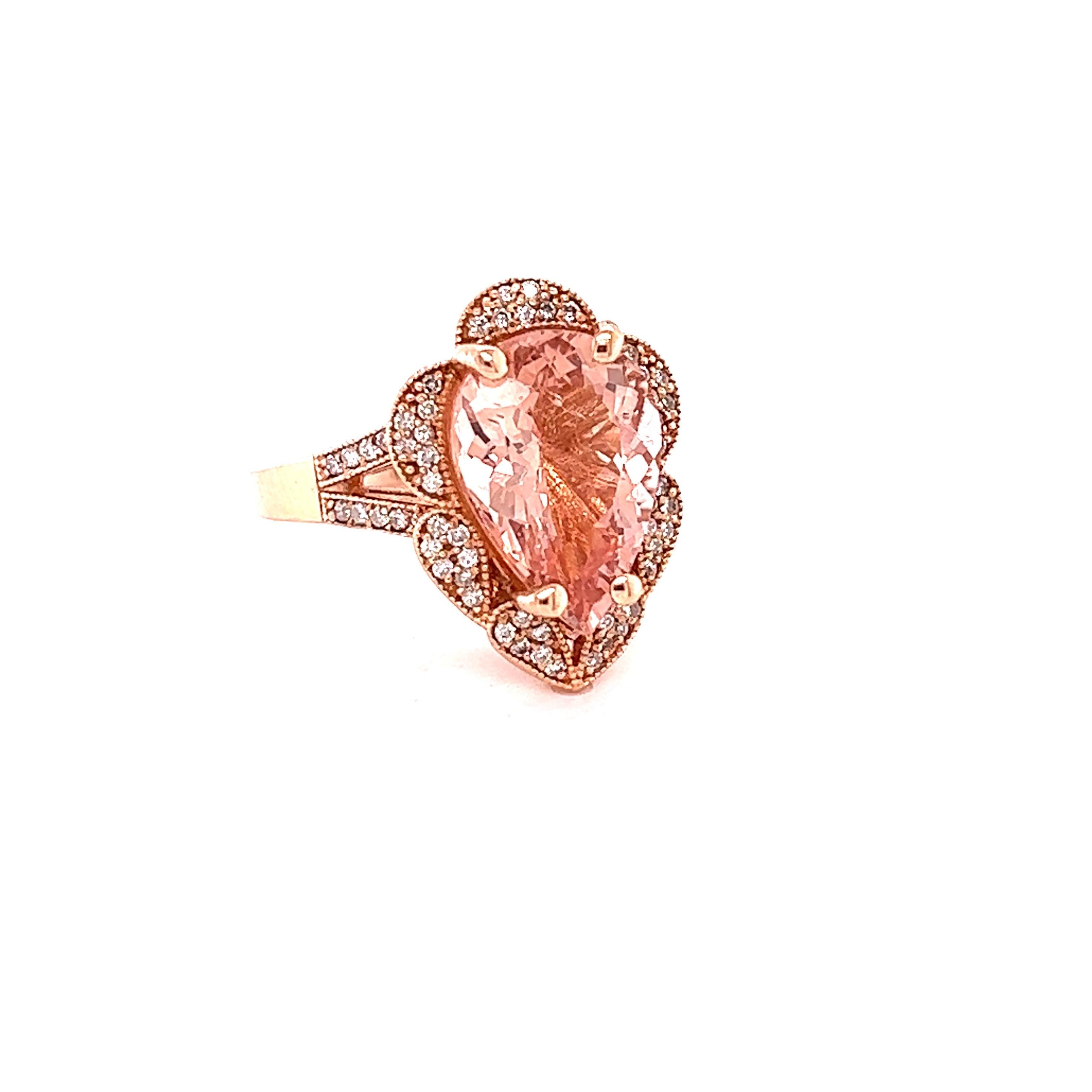 
This Morganite Diamond Ring has a 4.59 Carat Pear Cut Peach Morganite and is surrounded by 67 Round Cut Diamonds that weigh 0.42 carats. (Clarity: VS, Color: H) The Total Carat Weight of the ring is 5.01 Carats.  

The morganite measures at