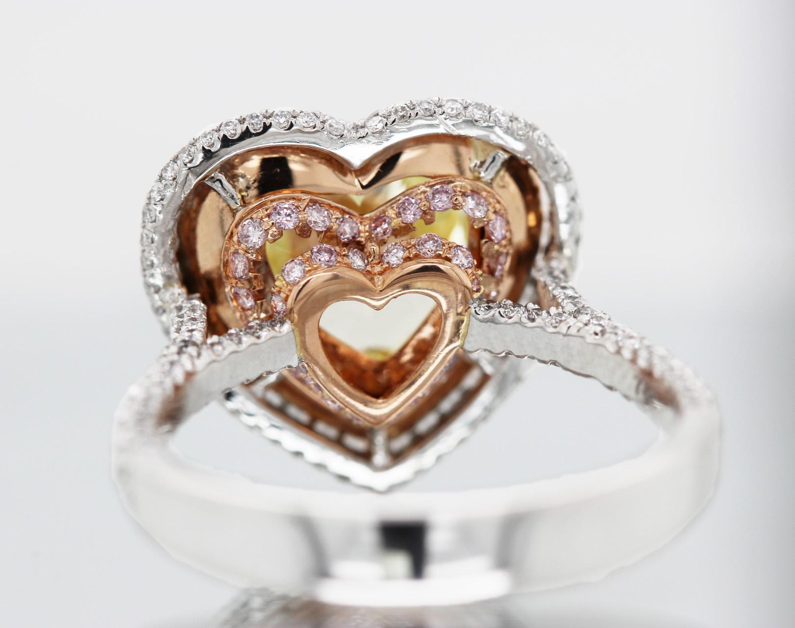 Natural Fancy Yellow heart-shaped 5.05 carat diamond engagement ring with GIA-certified diamonds on 18k rose gold and platinum setting. GIA-certified fancy yellow VS1 diamond engagement ring with a heart-cut 5.05 ct center stone and halo setting