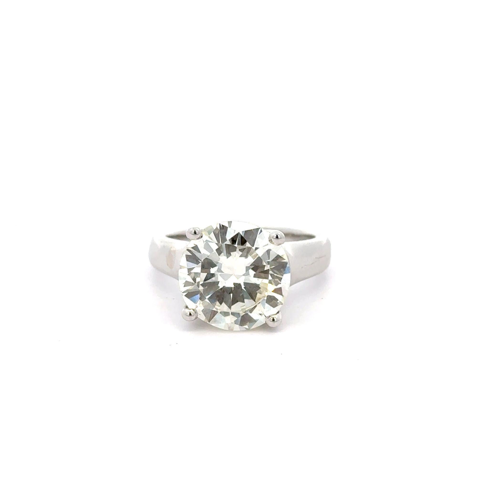 EGL Certified 5.01 Carat Round Cut Diamond in 14K White Gold Engagement Ring in Size 5.5. Set in a thick, wide ring setting for the working ladies who use their hands a lot.

Details:
Type: Engagement Ring
Metal: 14K White Gold
Size: 5.5
Setting:
