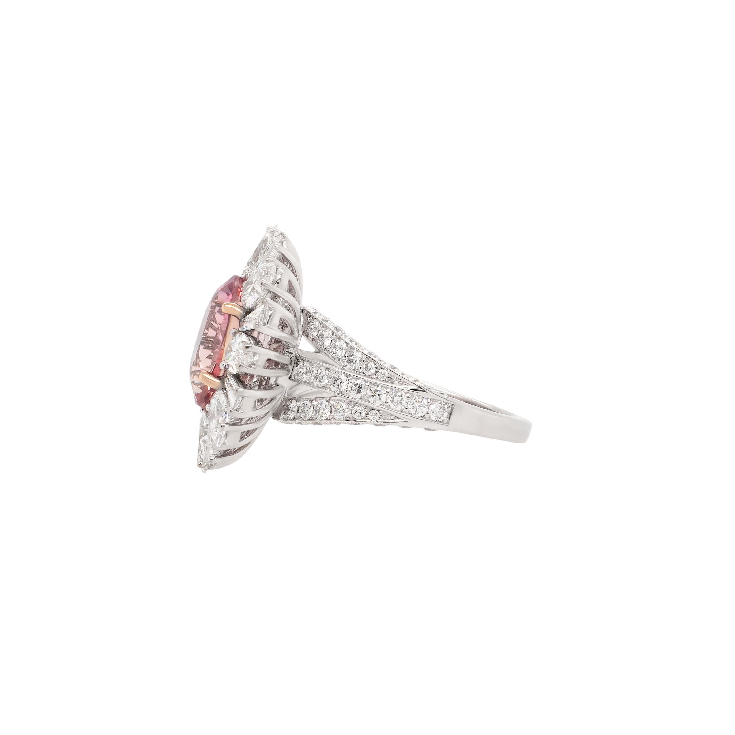 This rare 5.02 ct unheated “Sunset” Padparadscha sapphire from Sri Lanka dazzles with its vivid pink-orange hue and exceptional clarity. Framed by 3.22 ct of fancy shaped diamonds and set in an elegant design, it’s a true collector’s