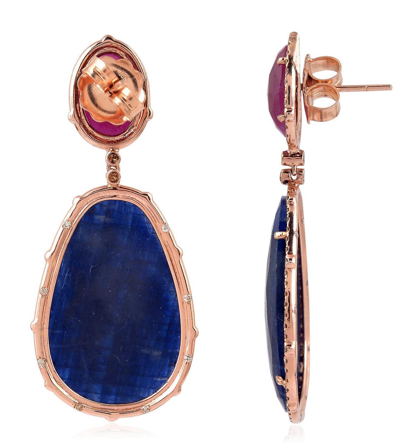 Handcrafted from 18-karat gold, these exquisite earrings are set with 50.19 carats of blue sapphire, 7.3 carats ruby and 1.76 carats of glimmering diamonds. 

FOLLOW  MEGHNA JEWELS storefront to view the latest collection & exclusive pieces.  Meghna
