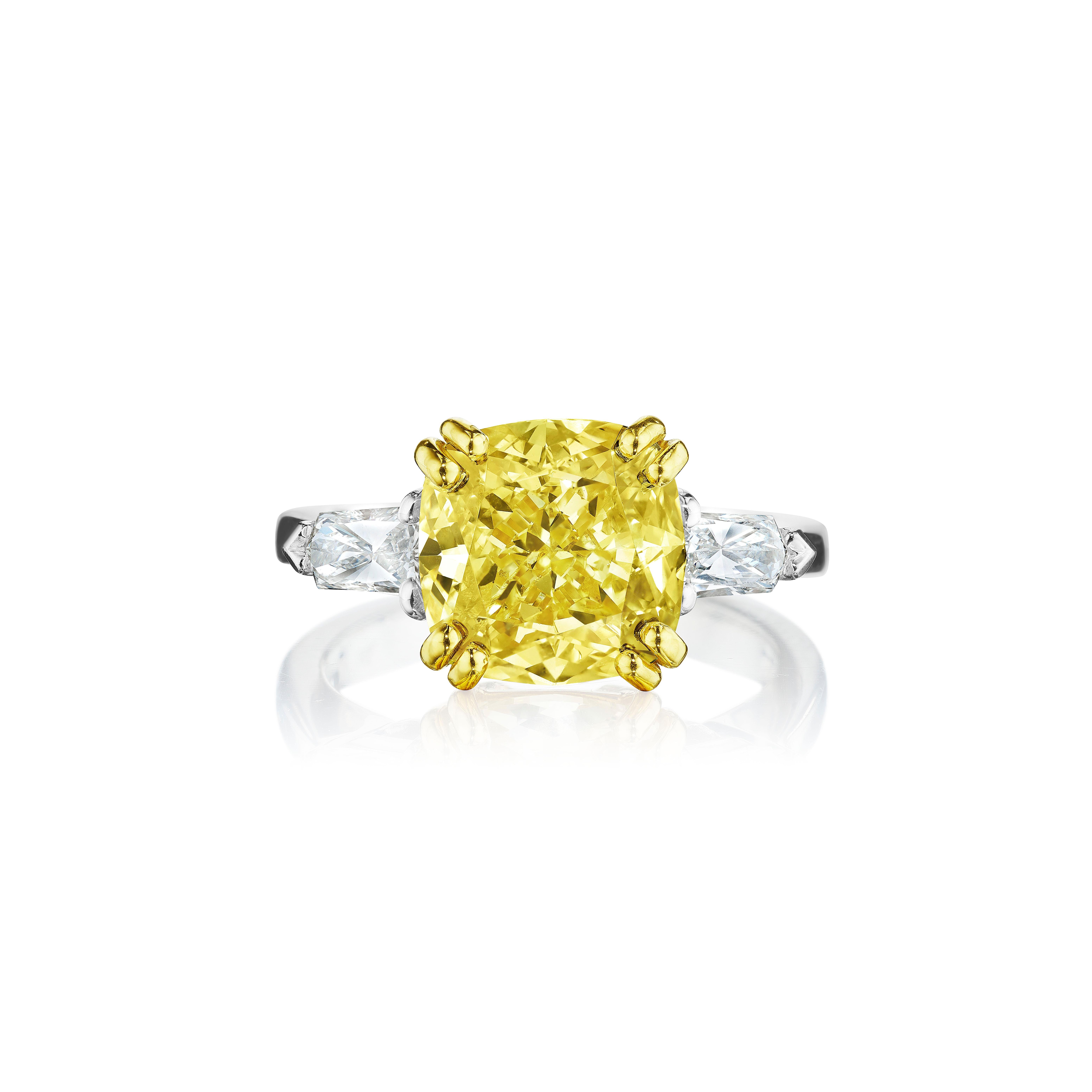 •	Gold: Platinum & 18KT Yellow
•	Size: 6.5
•	5.85 Carats

•	Number of Cushion Diamonds: 1
•	Carat Weight: 5.01ctw
•	Color: Fancy Brownish Yellow
•	Clarity: I1
•	GIA: 6214246644

•	Number of Bullet Cut Diamonds: 2
•	Carat Weight: 0.57ctw
•	Color: