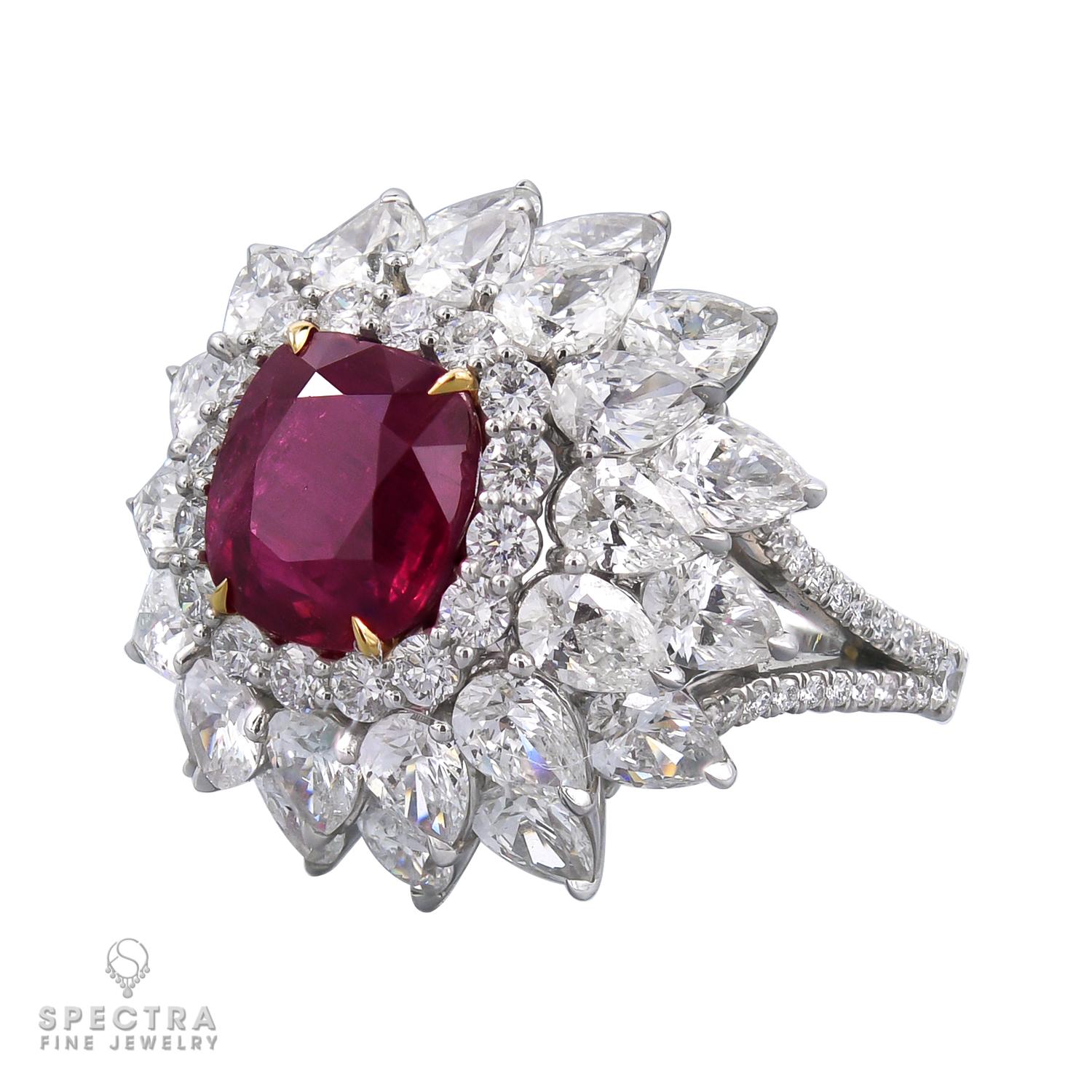 A cocktail ring featuring a cushion ruby in the center and surrounded by diamonds.
The ruby is certified by AGTA lab, stating that the origin is East Africa with the indication of minor heating.
28 pear shape diamonds weighing a total of 7.05