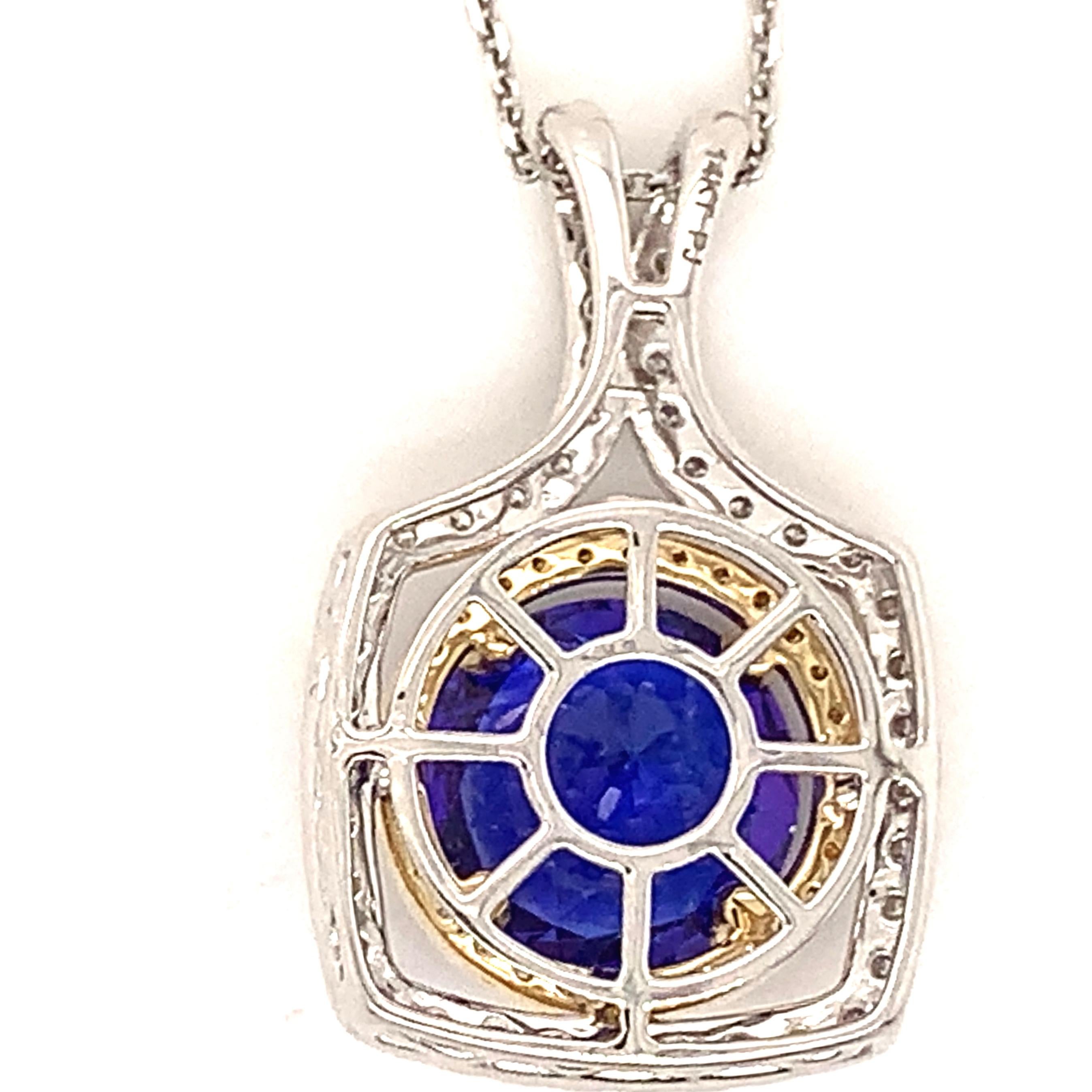 Round Tanzanite have been one of our treasured gems. This beautiful 502 carats loupe clean Tanzanite is surrounded with 75 VS grade, G colored diamonds weighing a total of 0.75 carats.
The pendant is two tone white and yellow 14 karat gold. The bale