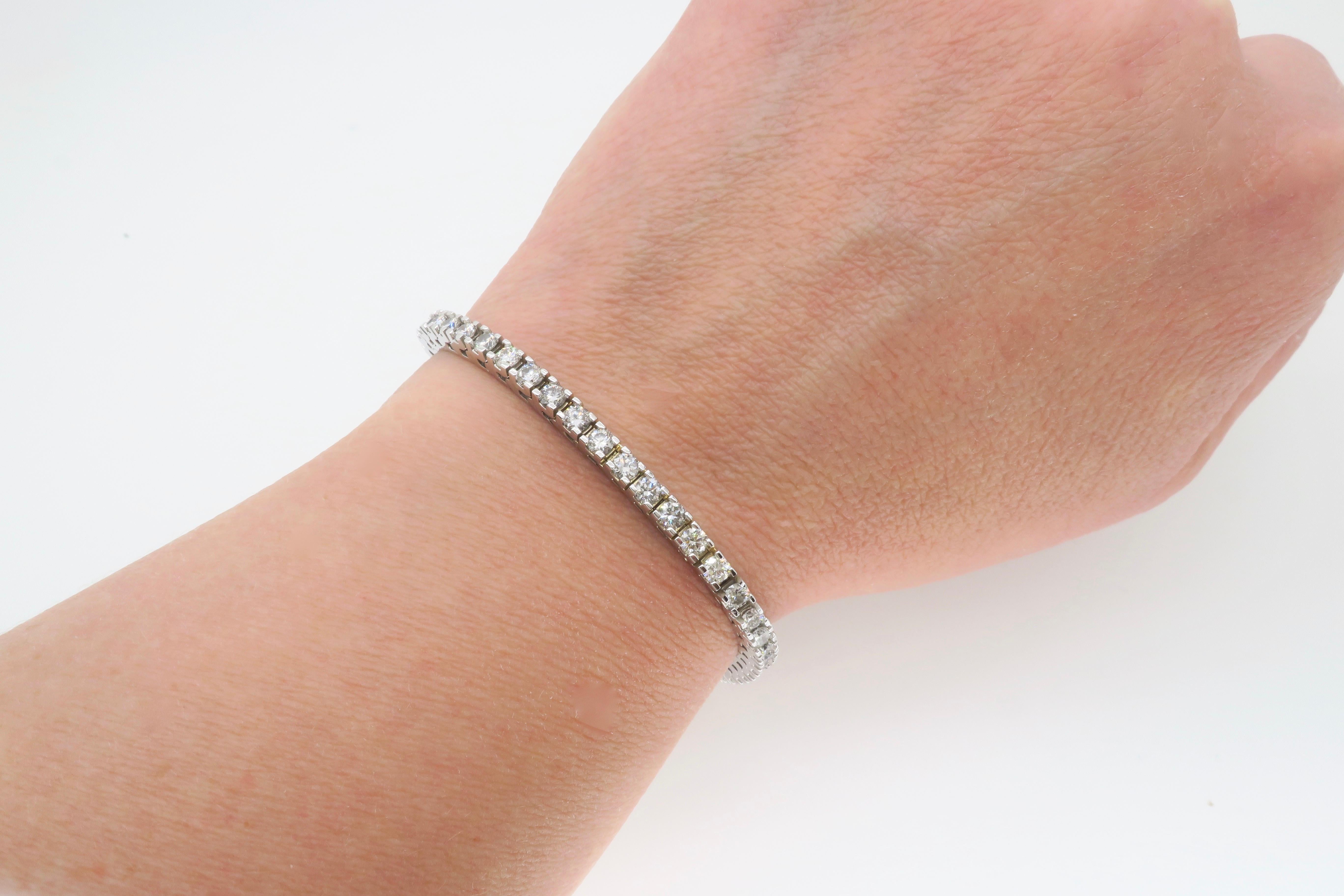 Classic diamond tennis bracelet made in 14k white gold with 5.02ctw of diamonds. 

Diamond Carat Weight: Approximately 5.02CTW
Diamond Cut: Round Brilliant Cut     
Color: Average: H-J
Clarity: Average: VS-SI
Metal: 14K White Gold
Marked/Tested: