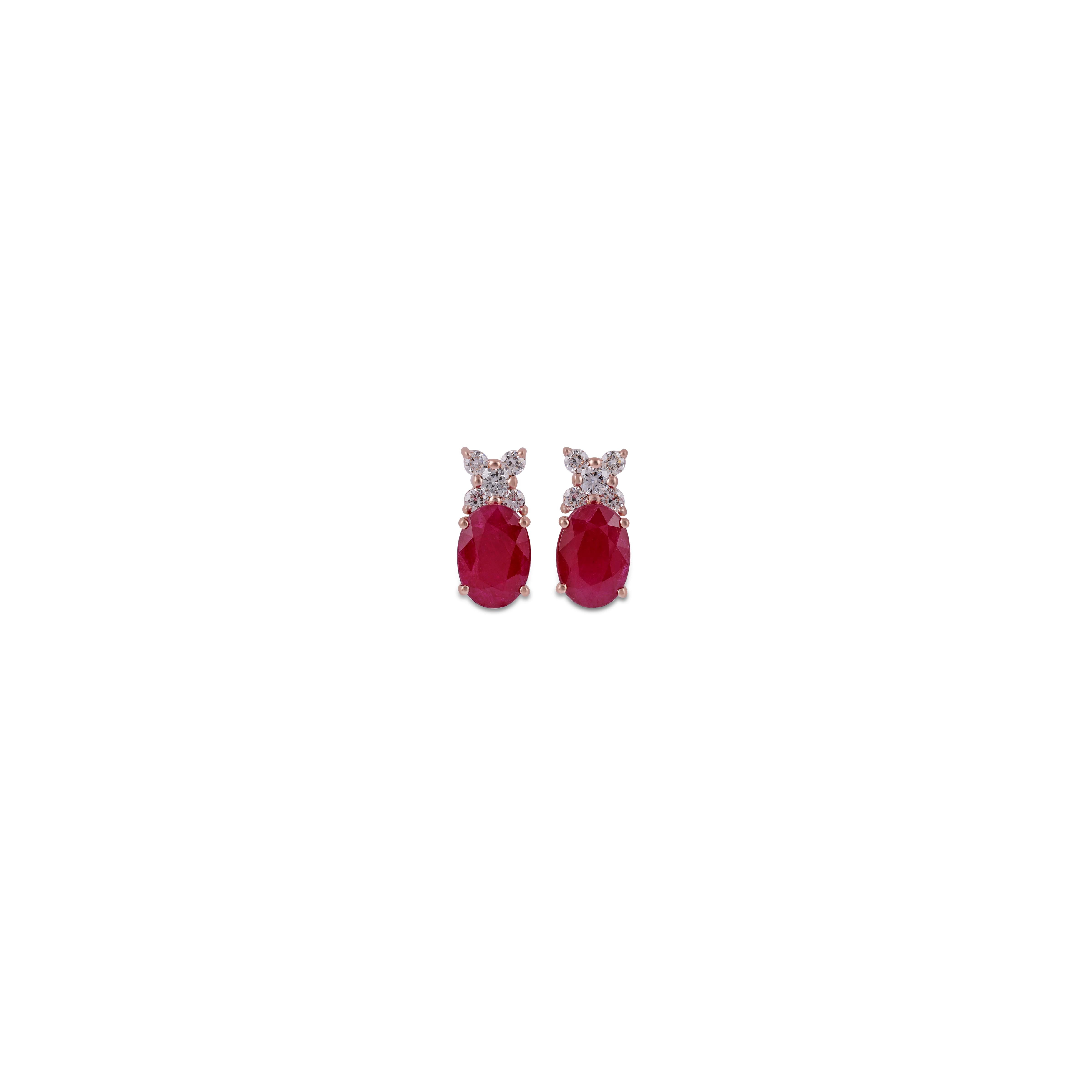 This is an elegant Ruby & diamond Earring studded in 18k Rose gold with 2 piece of oval Cut  shaped Mozambique Ruby weight 5.03 carat With 10 pieces of round shaped diamonds weight 0.54 carat.
This entire Earring  studded in 18k Rose gold weight
