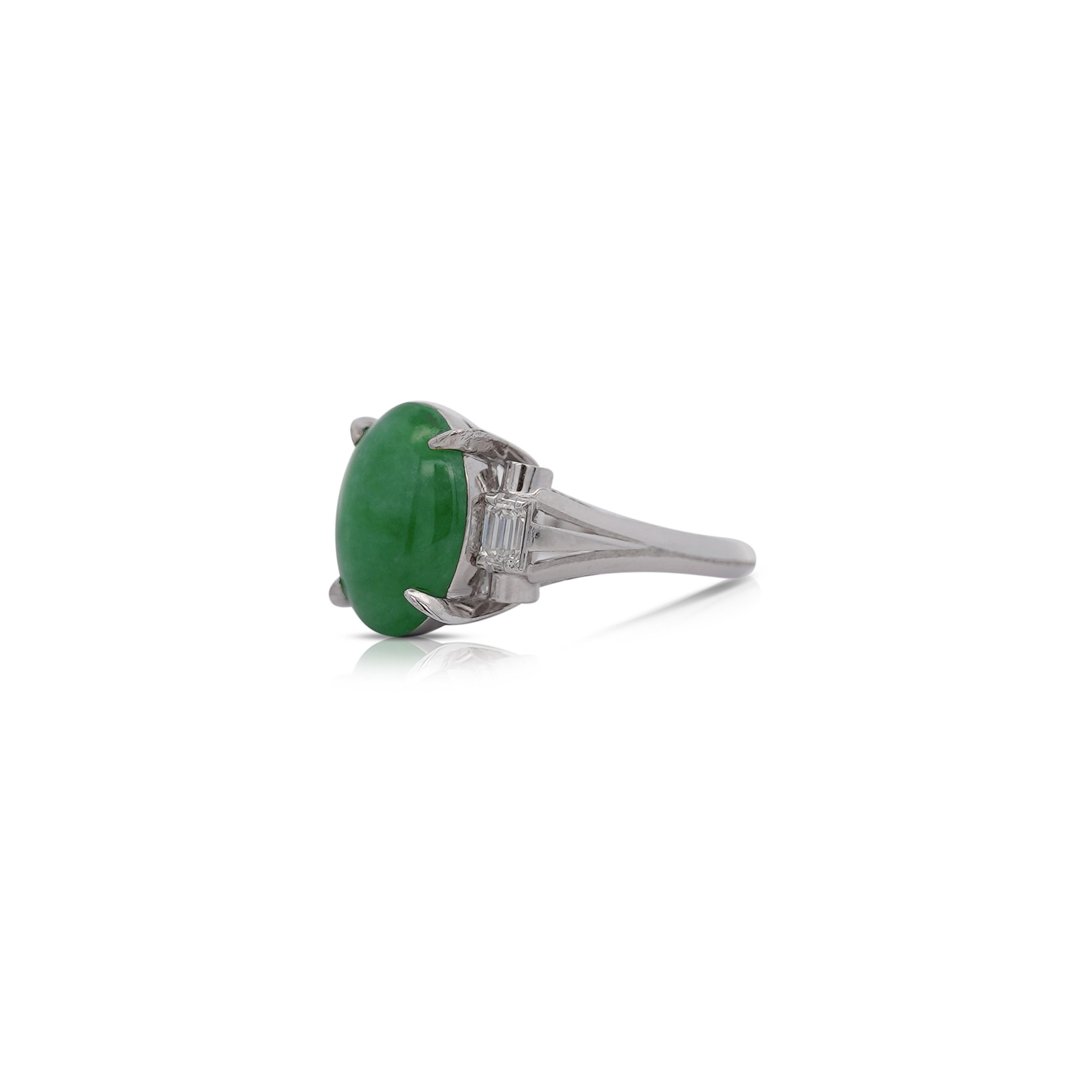 Untreated Grade A Green Jadeite Jade and Diamond Three Stone Ring in Platinum Ring. 

Details:
Item Type: Ring
Metal: Platinum 900
Size: 6
Weight: 7.98 Grams
Setting: Cathedral split band, Filigree

Center Stone Details:
Stone Type: Jade
Carat: