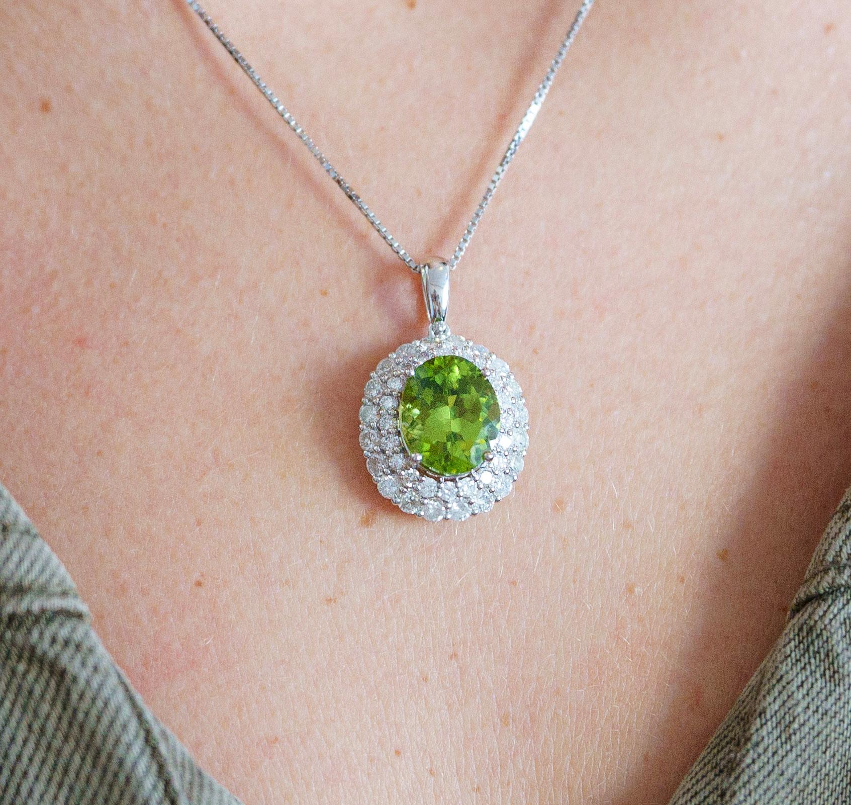 Art Deco 5.03 Carat Oval Peridot Pendant with Round Cut Diamond Halo in 18K White Gold For Sale