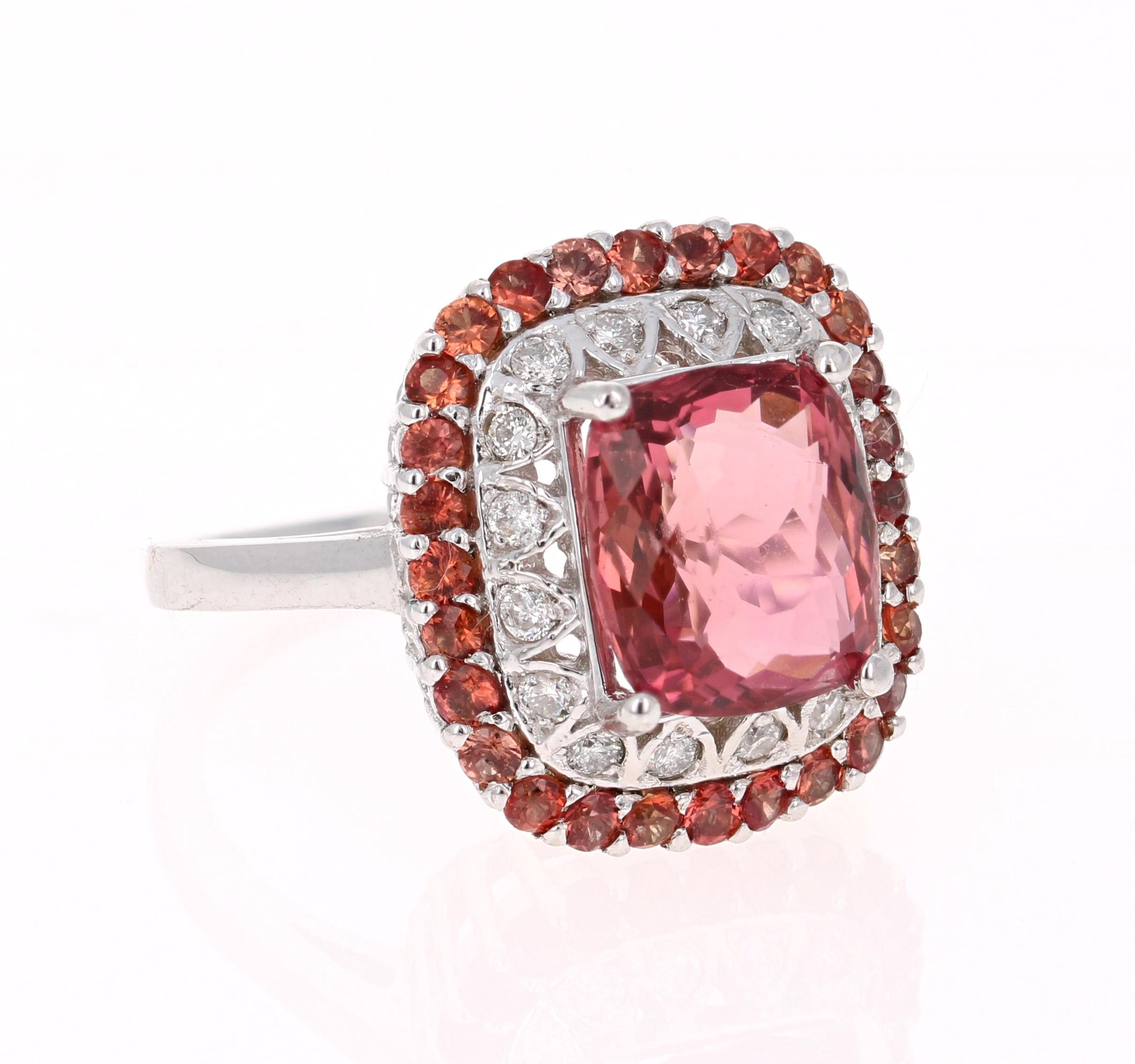 Wow! Beautiful and Unique Tourmaline Ring in a gorgeous White Gold Setting.

This ring has a Cushion Cut Orangey-Mauve Tourmaline that weighs 3.79 Carats. Floating around the tourmaline are 16 Round Cut Diamonds in a halo weighing 0.28 Carats.