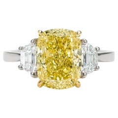 5.03 Carats Fancy Yellow Cushion Cut Diamond Three-Stone Ring