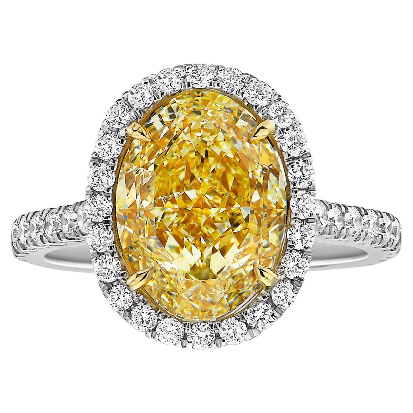5 Carat VS1 Light Yellow Oval Halo Diamond Ring For Sale