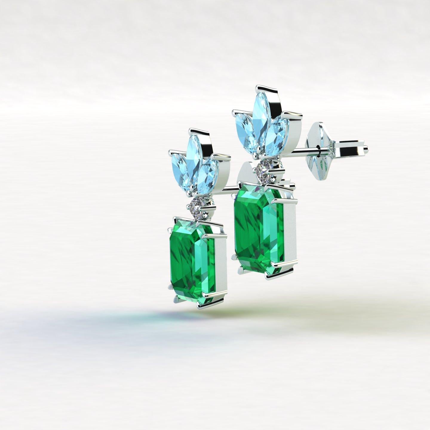 5.04 Karat passender natürlicher Smaragde aus Kolumbien, mit ca. 0,08 Karat weißer Diamanten im Rundschliff, Farbe G, Reinheit VS, und ca. 1 Karat blauer Aquamarine im Marquise-Schliff, gefasst im Original Ferrucci-Design in Platin 950.
