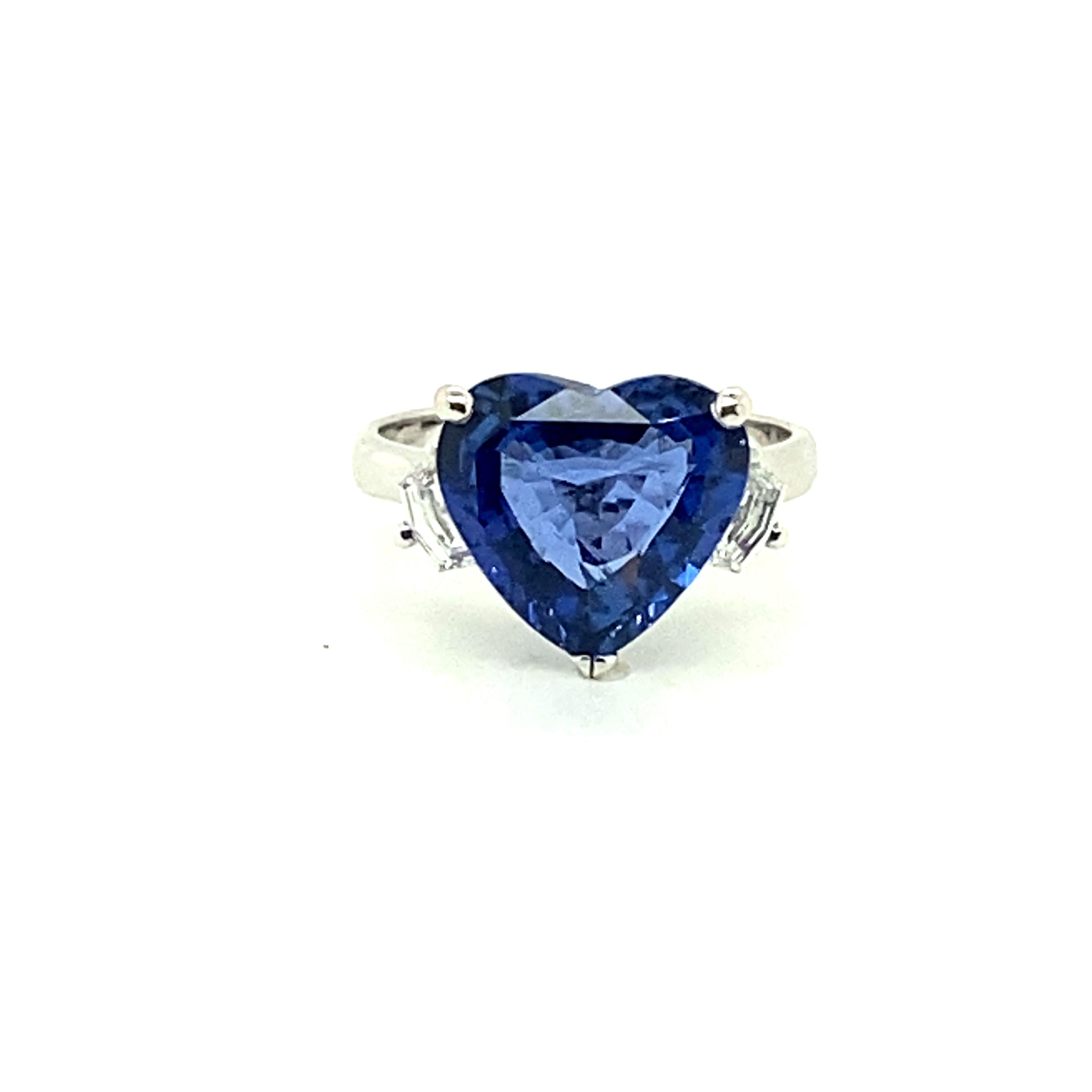 5.04 Carat Heart-Shape Vivid Blue Ceylon Sapphire and White Diamond Ring:

A gorgeous ring, it features an elegant heart-shaped natural heated Ceylon vivid blue sapphire weighing 5.04 carat, with white fancy-cut diamonds on both sides of the