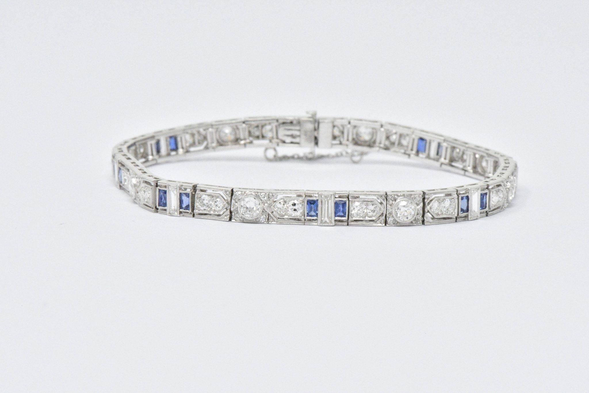 Set with old European, full, single and baguette cut diamonds, approximately 3.44 carats total, G to J color and VS to I clarity
With rectangular French cut sapphires, approximately 1.60 carats total, bright blue, very well matched
With pierced
