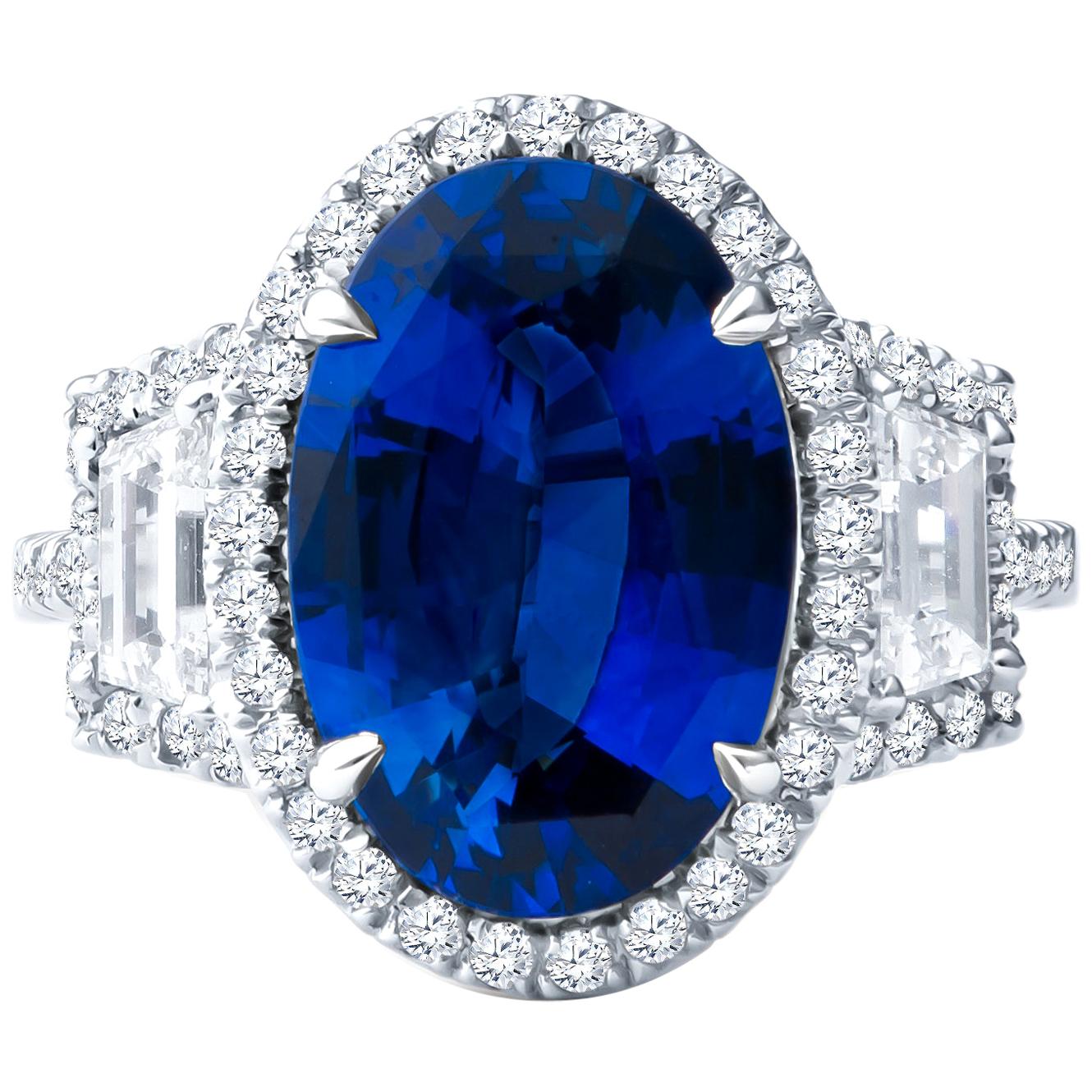 5.04ct Oval Sapphire with 0.68ctw Step Cut Trapezoid & 0.50ct Diamond Halo Ring