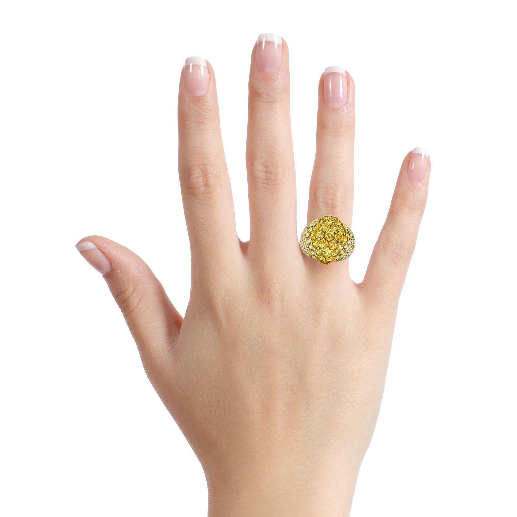 Diamond and vibrant yellow sapphires bombe ring crafted in 18-karat yellow gold. Polished metal dome ring setting with 5 carats of round-cut natural yellow sapphires, and pave diamonds on the sides. Made in Italy. Signed, Italian Marker's Mark 2802