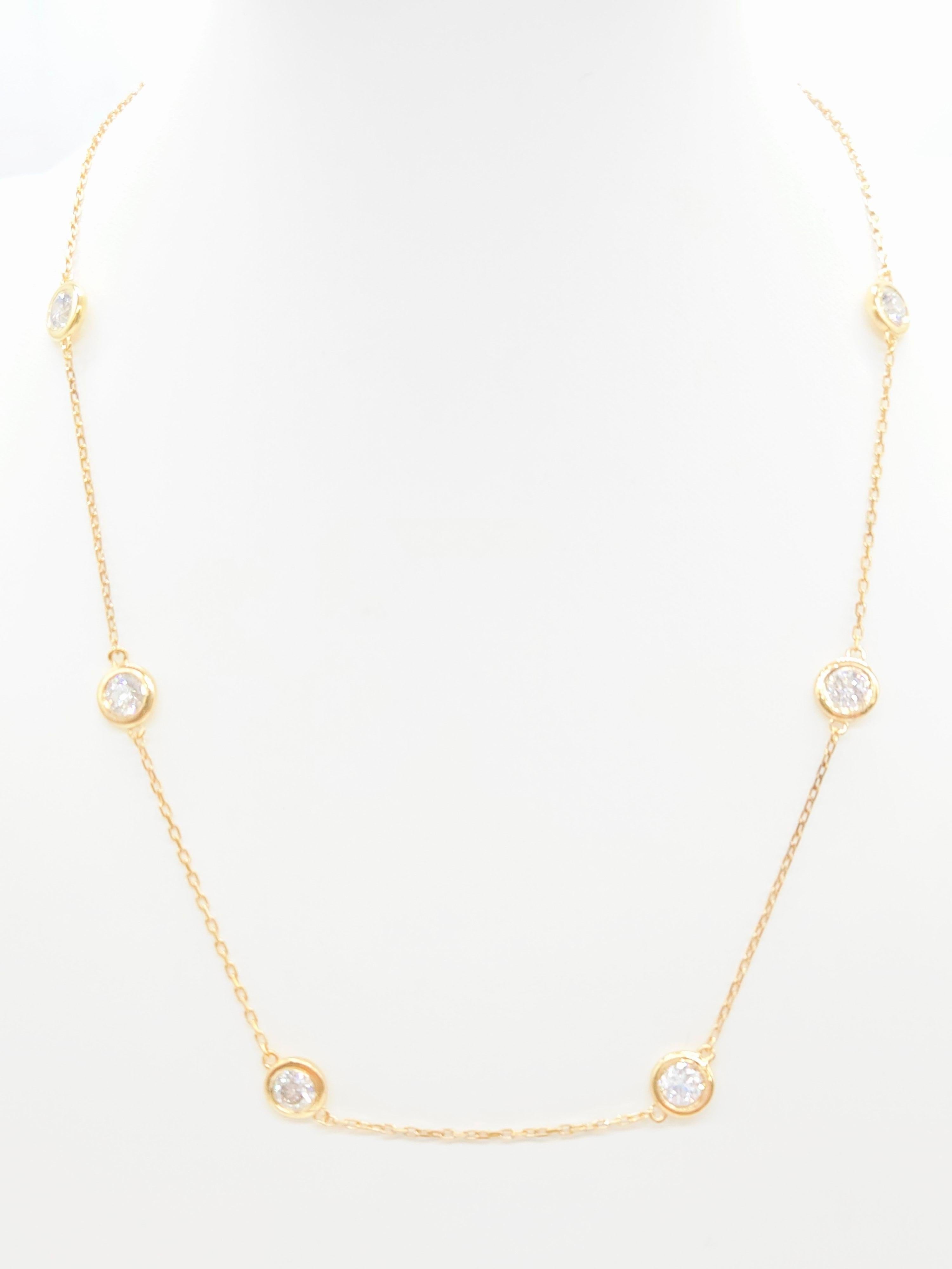 Elegant and timeless, this 5.05 Carat Natural Diamond By The Yard Necklace is crafted in 14 Karat Yellow Gold. The design features sparkling round brilliant-cut diamonds bezel-set at intervals along a 16-inch chain, creating a delicate yet luxurious