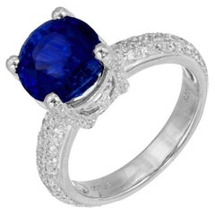 Bague de fiançailles en platine avec saphir bleu rond de 5,05 carats et diamants