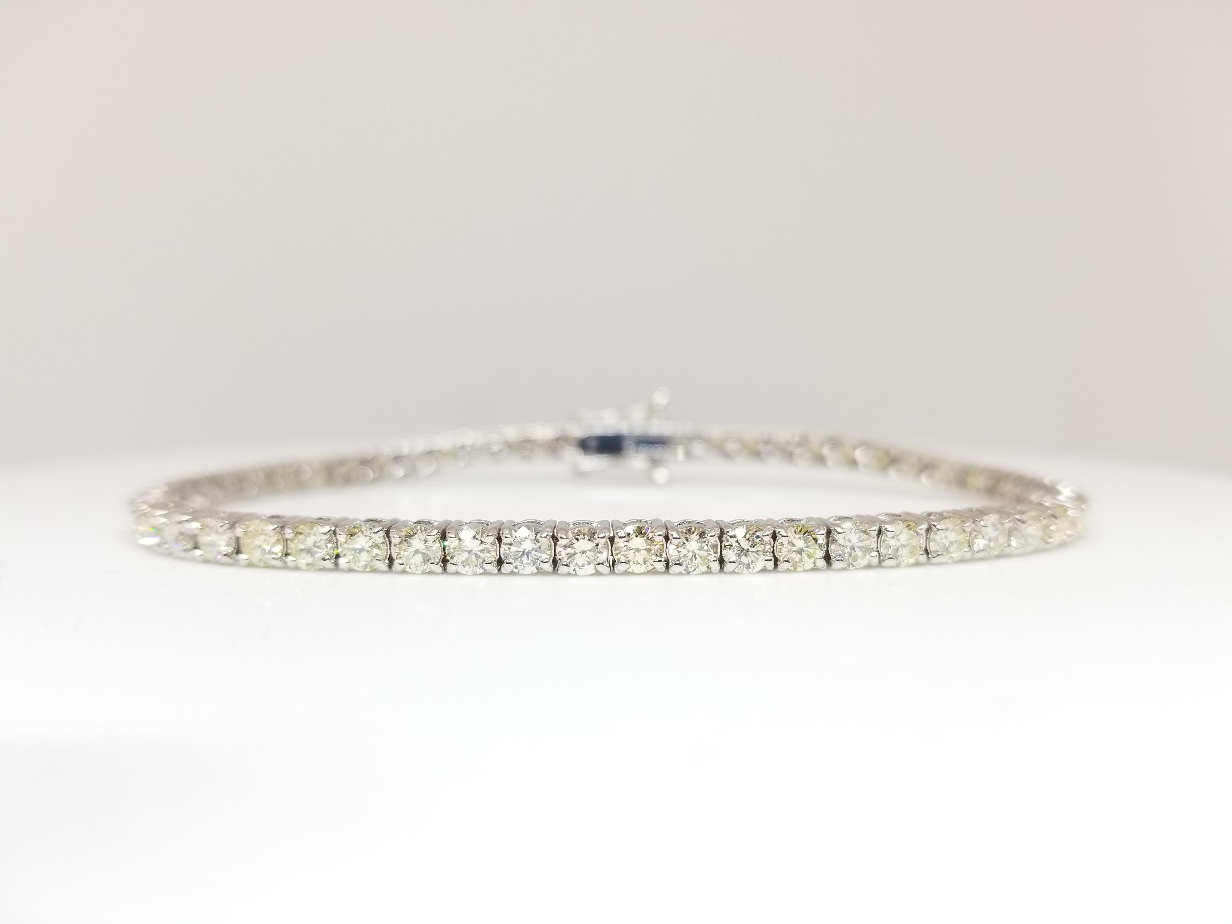 Very sparkling and shiny. a great quality tennis bracelet. 14k white gold. each stone is set in a classic four-prong style for maximum light brilliance. 7 inch length. Color I-J, Clarity SI2.
