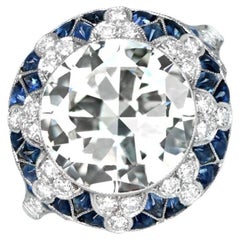 5.05ct Transitional Cut Diamond Ring with Geometric Starburst Halo and Sapphire