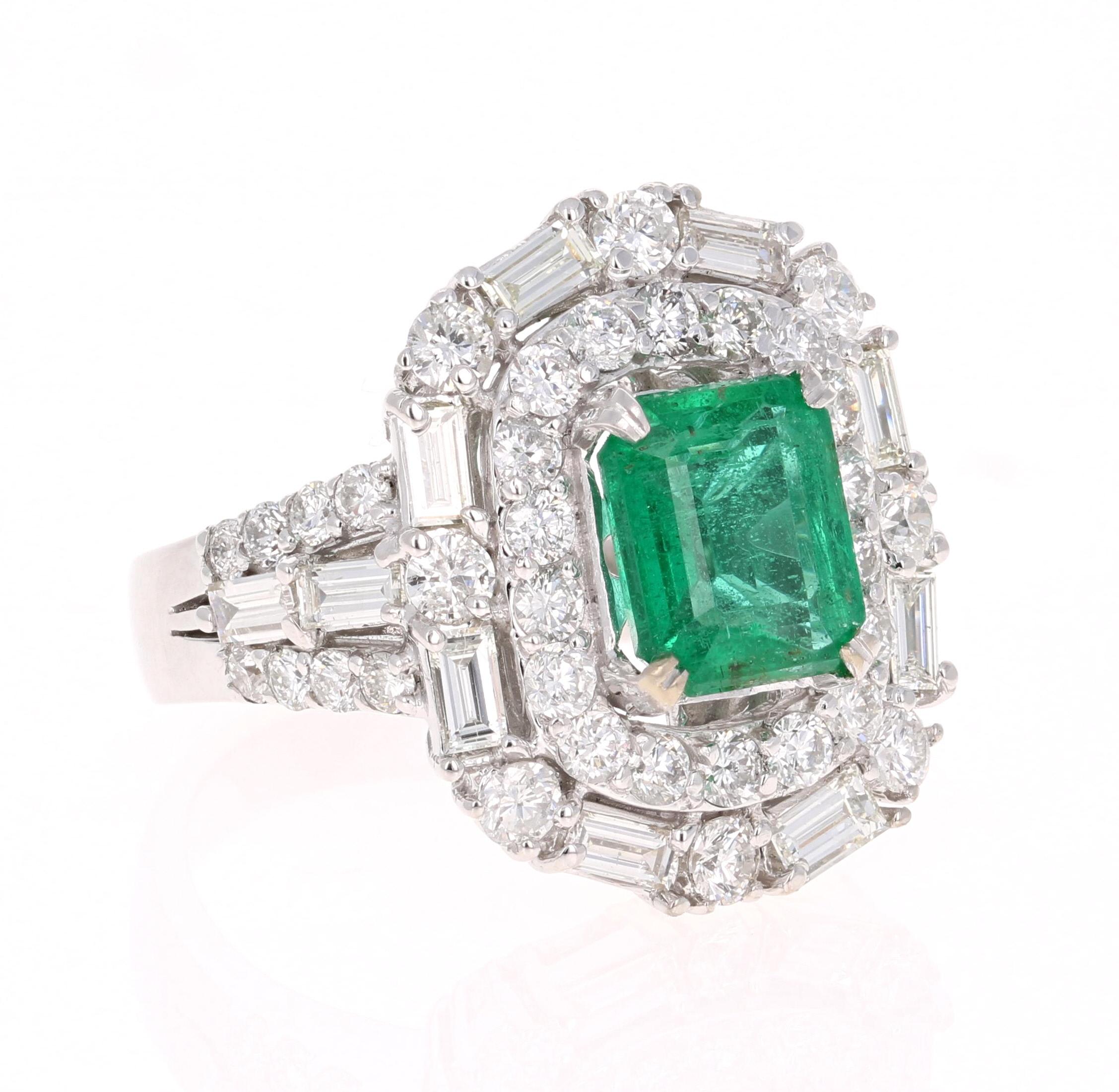 A beautiful, unique, art-deco inspired, 5.06 Carat Emerald and Diamond Ring in 18K White Gold. 
This gorgeous ring has a 2.45 Carat Emerald Cut Emerald that is set in the center of the ring! The Emerald is GIA Certified and the certificate number