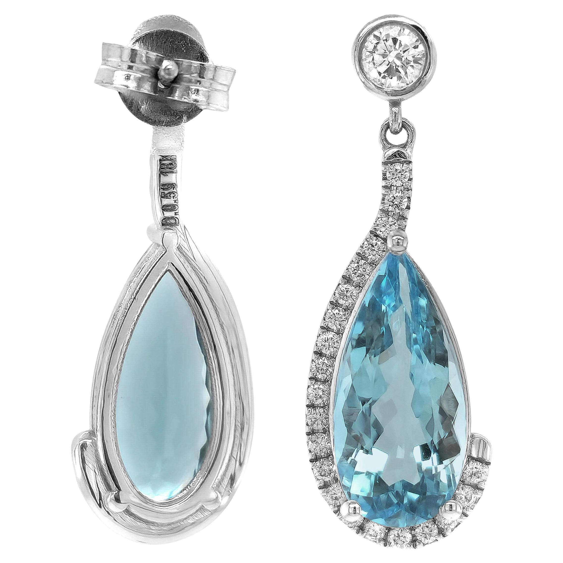 Introducing our bespoke 18K white gold dangle earrings, a timeless masterpiece of meticulous craftsmanship. Radiating a rich shine and attention to detail, they showcase two pear-shaped natural aquamarines with a captivating oceanic-sky blue hue.