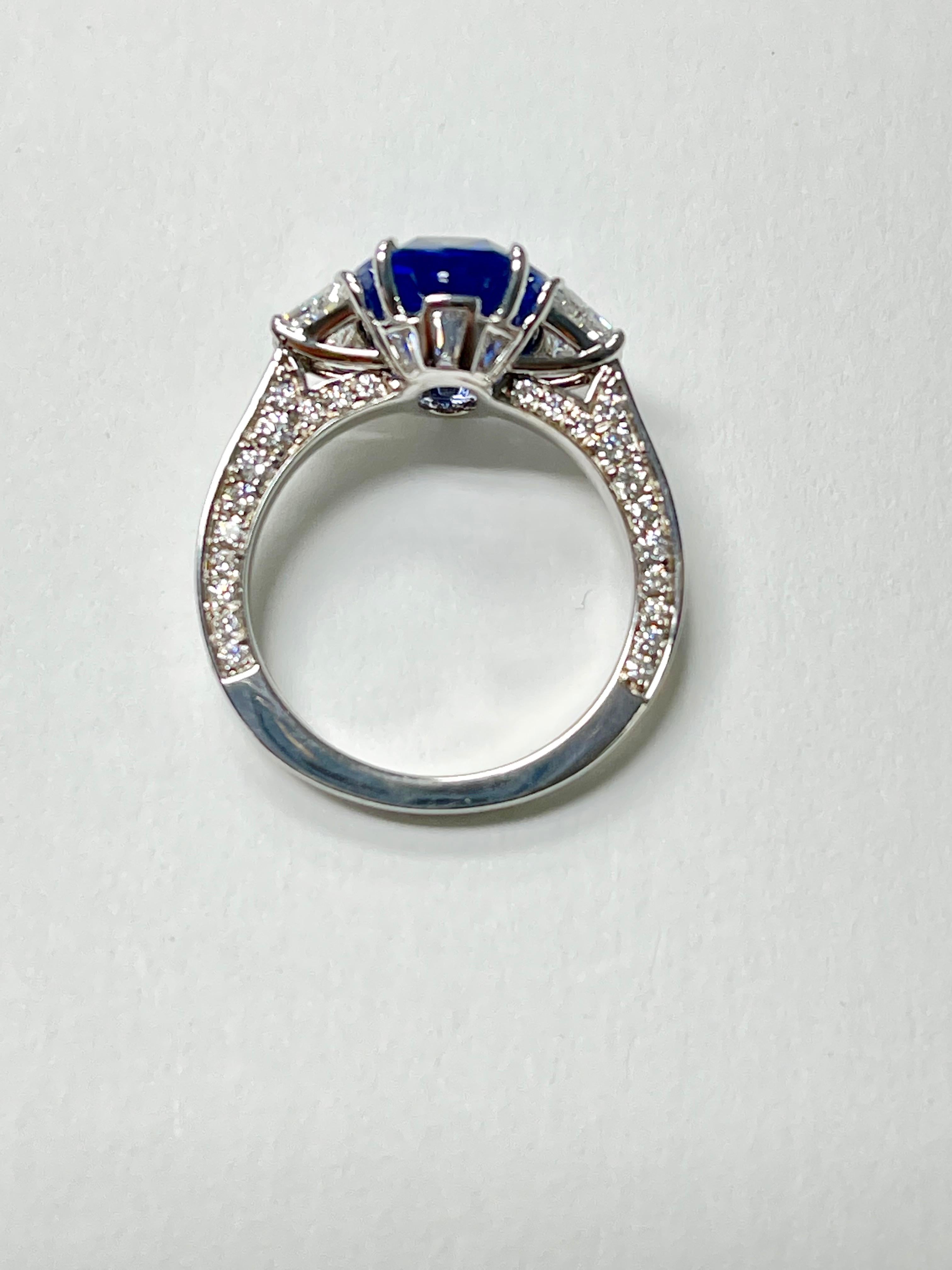 Contemporary 5.06 Carat Oval Blue Sapphire and Diamond Engagement Ring C.Dunaigre Certified. For Sale