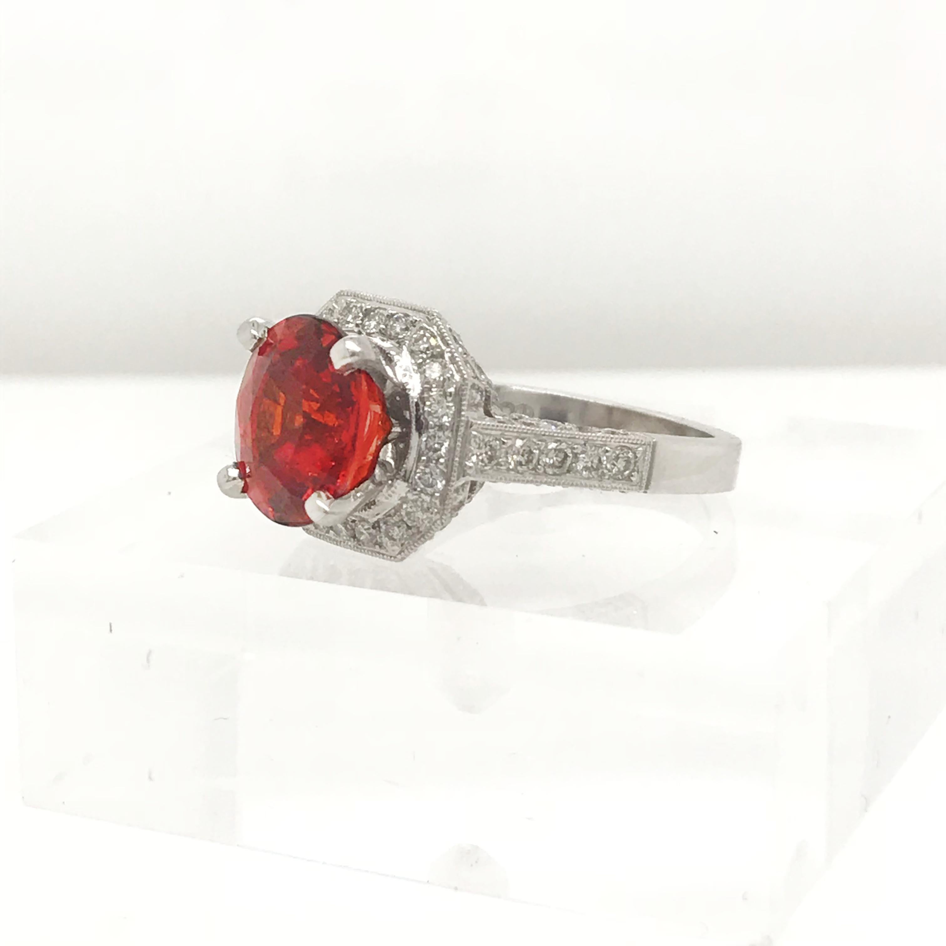 Amazing color saturation from this fine Spesserite Garnet set in 18kt white gold. There is 1 carat of colorless diamonds set within the 18kt white gold setting.
Oval cut Spessertite Garnet = 5.06 Carats
(84) Round Brilliant Cut Diamonds = 1.00