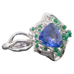 Anello da cocktail in oro 18k con tanzanite, smeraldo e diamante da 5,06 carati