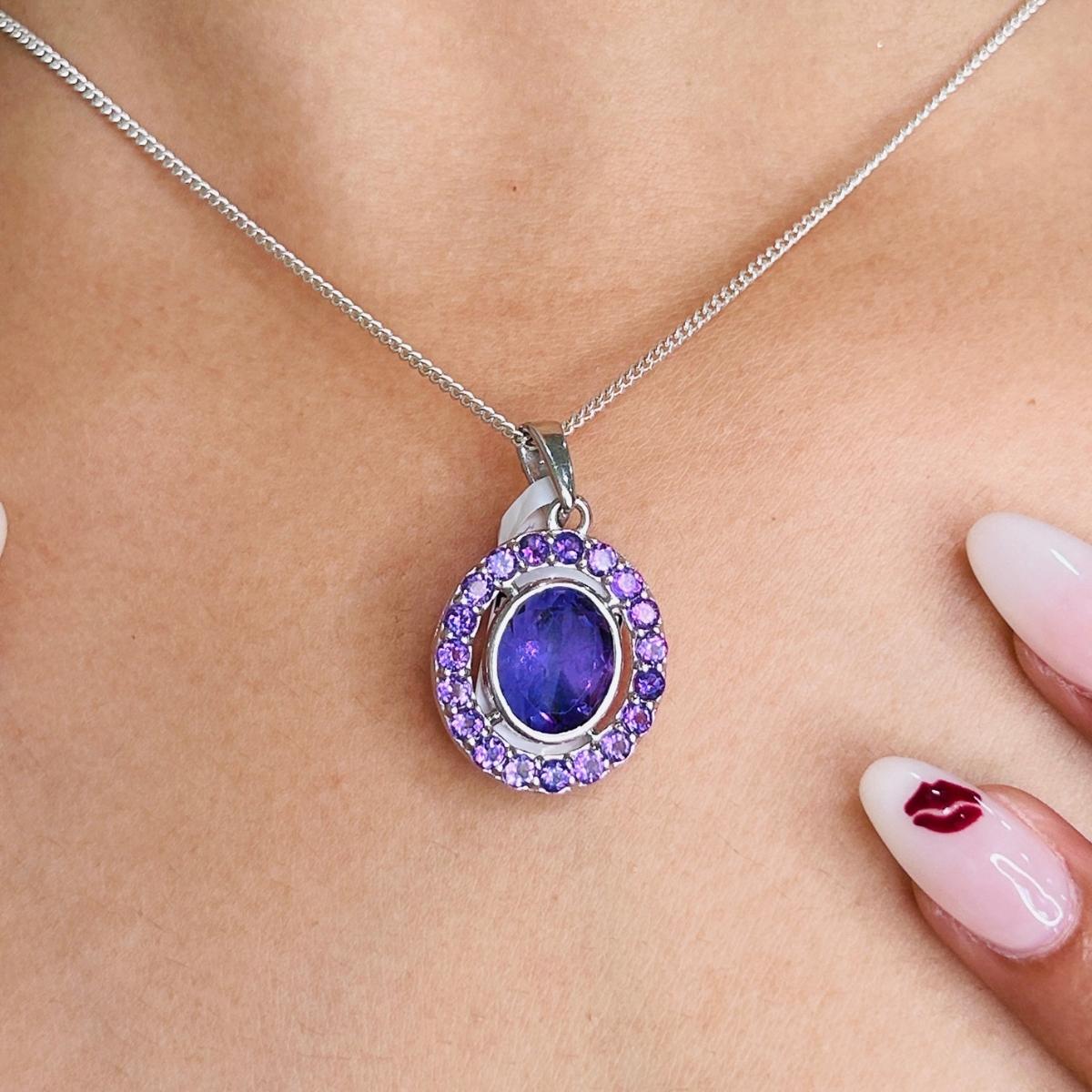 5.06 ctw Natural Amethyst Pendant Necklace in sterling silver studded with round cut amethyst. This stunning piece of jewelry instantly elevates a casual look or dressy outfit. 
Amethyst enhances the intellectual capacity of the person.
Designed