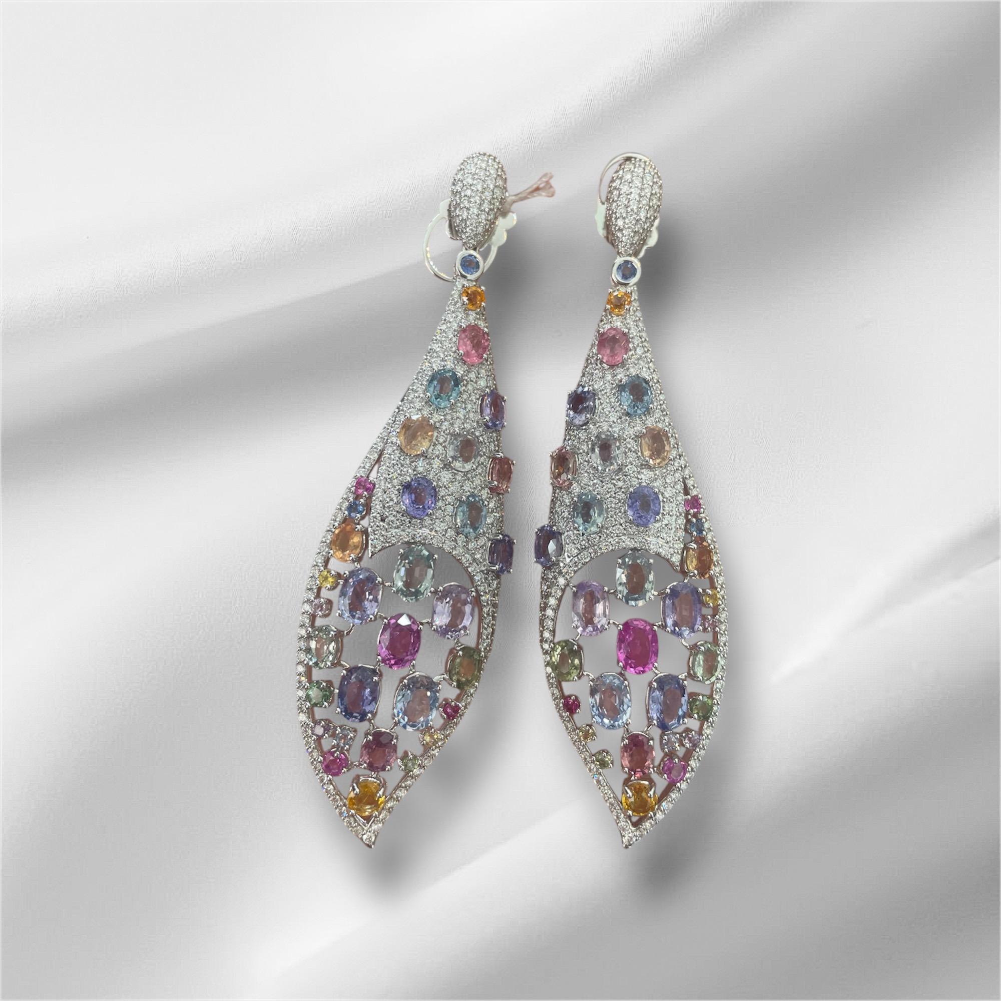 These exquisite chandelier earrings showcase a brilliant combination of multicolored sapphires and sparkling diamonds, set in 33.28 grams of luxurious gold. The 50.62 carats of sapphires, arranged in a stunning spectrum of rich blues, purples,