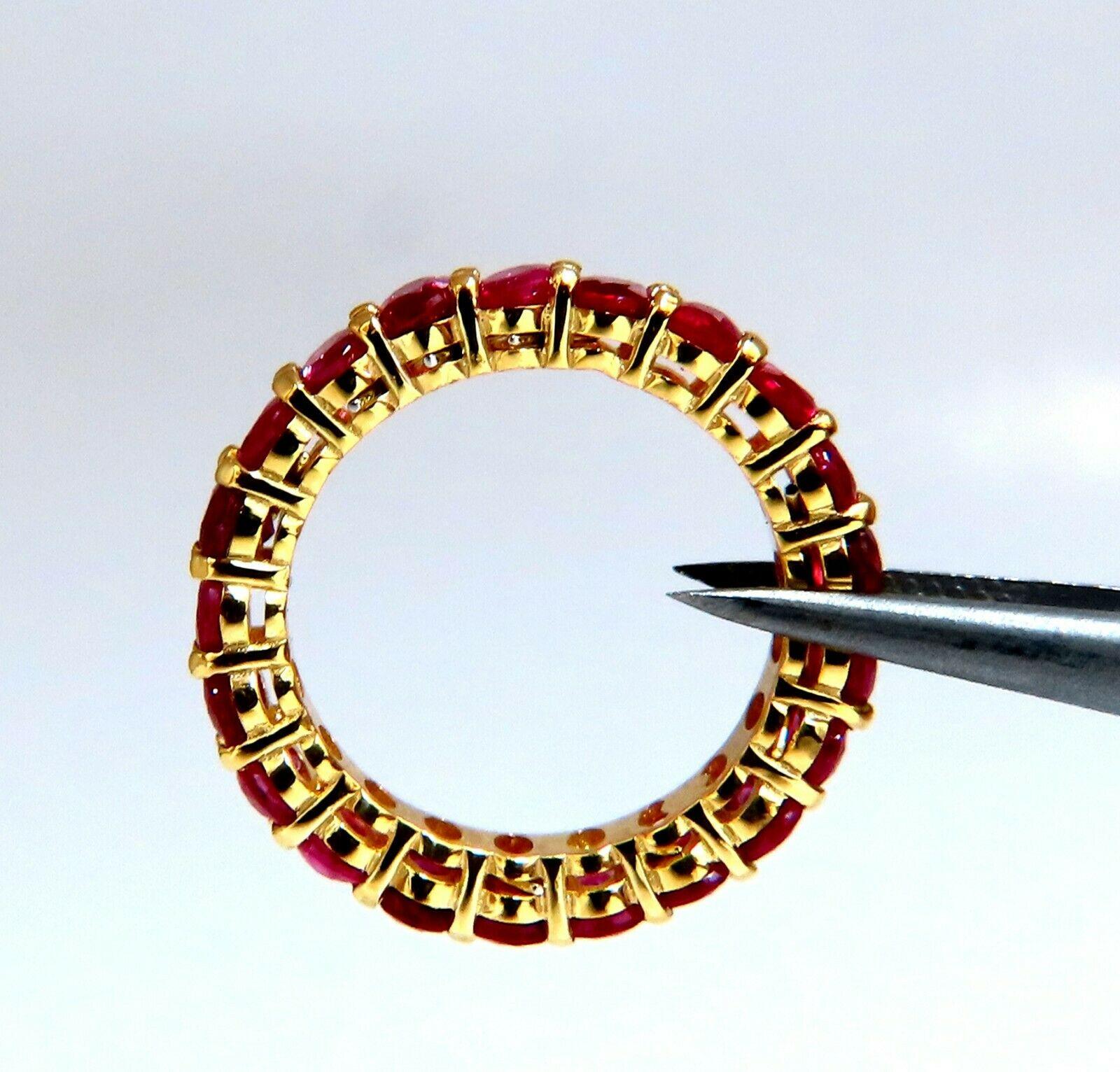 Eternity prime.

3.50 carat natural oval cut rubies sharing prong set eternity ring.

Burma classic.

Clean clarity transparent vivid red.

Ring is 4.1 mm wide

Depth 3.6 mm

14 karat yellow gold 4.4g

Size 6.5

$4000 appraisal certificate to