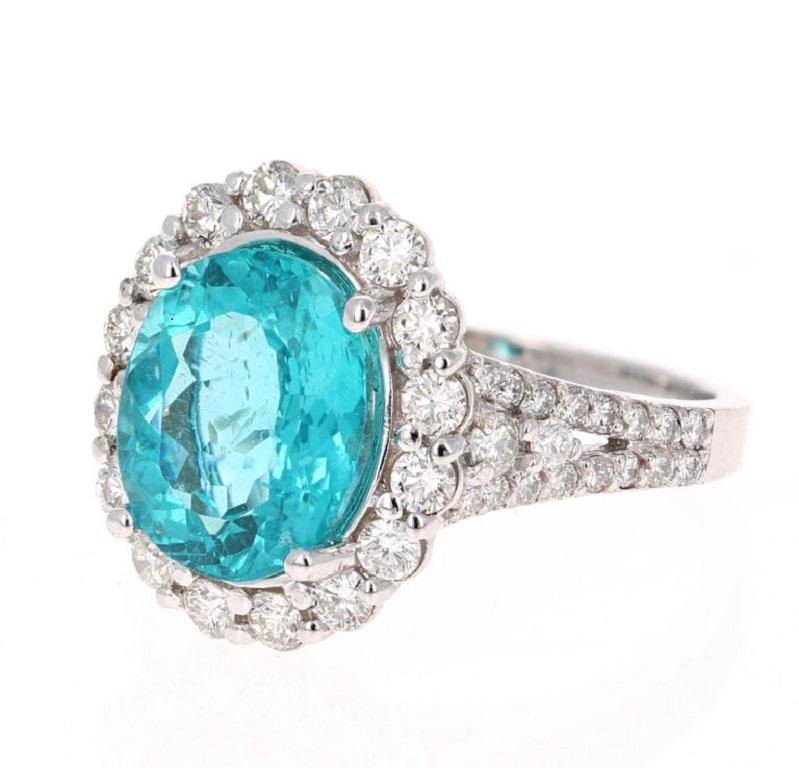 Stunning 5.07 Carat Apatite Diamond White Gold Bridal Ring that is sure to elevate your accessory collection or it can even be a great substitute for an Engagement Ring!

The ring has a 3.96 carat Oval Cut Apatite set in the center of the ring