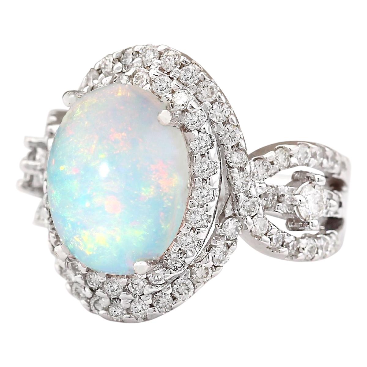 5.07 Carat Natural Opal 14 Karat White Gold Diamond Ring
Stamped: 14K White Gold
Total Ring Weight: 7.5 Grams
Total Natural Opal Weight is 3.77 Carat (Measures: 12.00x10.00 mm)
Color: Multicolor
Total Natural Diamond Weight is 1.30 Carat
Color: F-G,