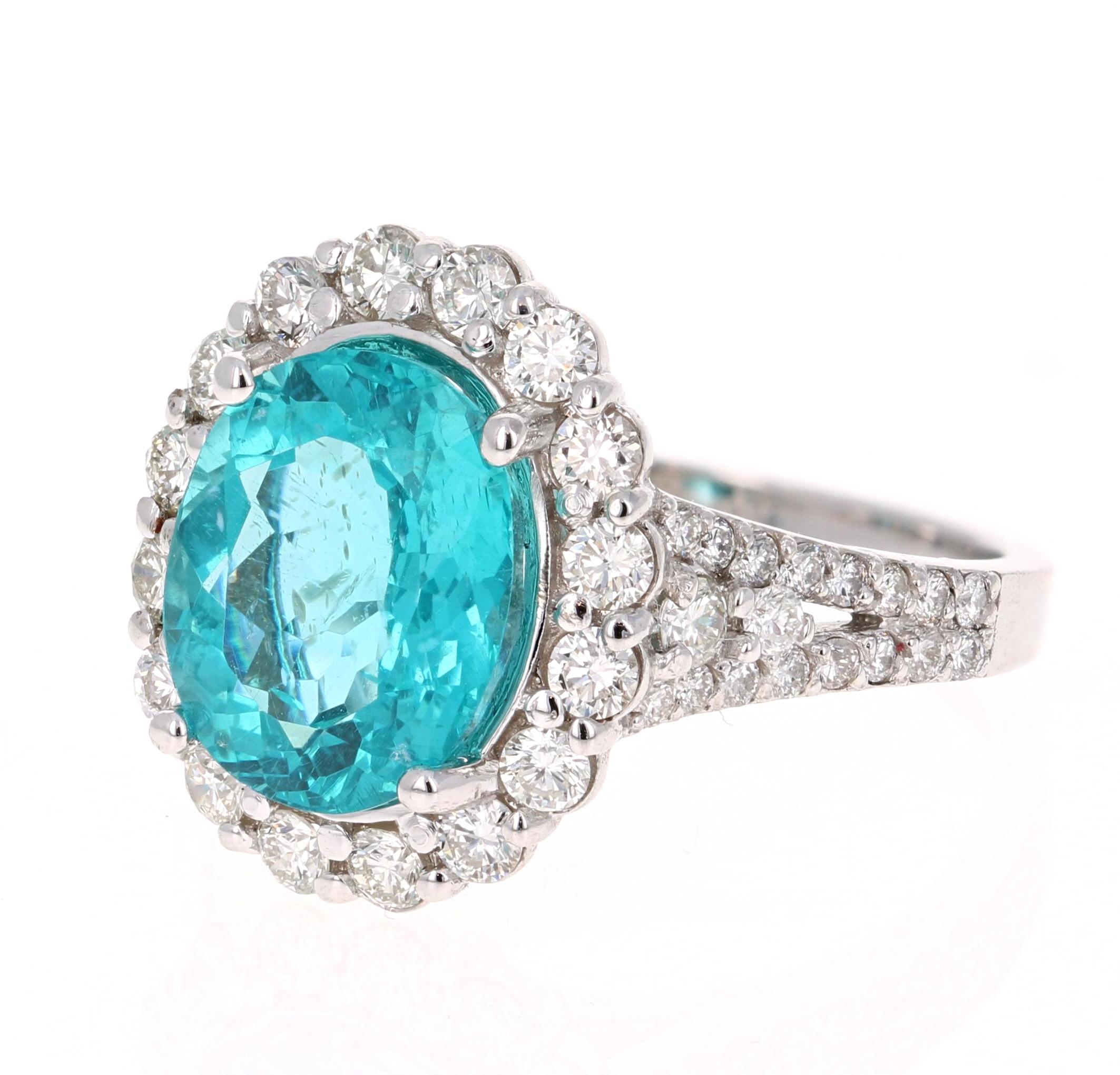 Stunning 5.07 Carat Apatite Diamond White Gold Bridal Ring that is sure to elevate your accessory collection or it can even be a great substitute for an Engagement Ring!

The ring has a 3.96 carat Oval Cut Apatite set in the center of the ring