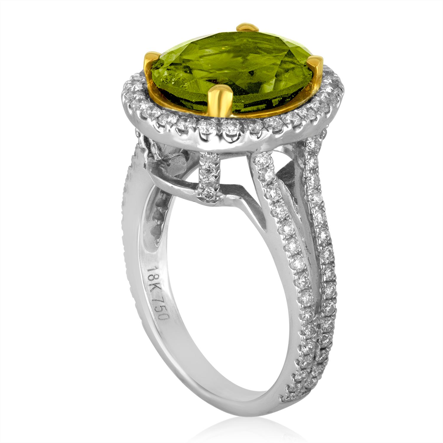 Beautiful Peridot Stone set in a Diamond Split Shank Halo Setting
The ring is 18K White & Yellow Gold
There is 1.00 Carat in Diamonds F VS/SI
The center stone is an Oval Peridot 5.07 Carats
The ring is a size 5.75, sizable
The ring weighs 7.3 grams