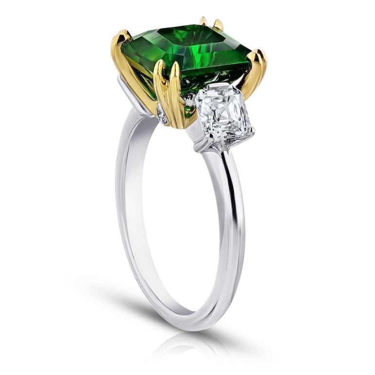 5.07 carat square emerald green tsavorite with antique square and round brilliant cut diamonds 1.13 carats set in a platinum and 18k yellow gold ring.
