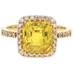 5.07 Carat Yellow Sapphire Diamond Halo 18 Karat Yellow Gold Ring