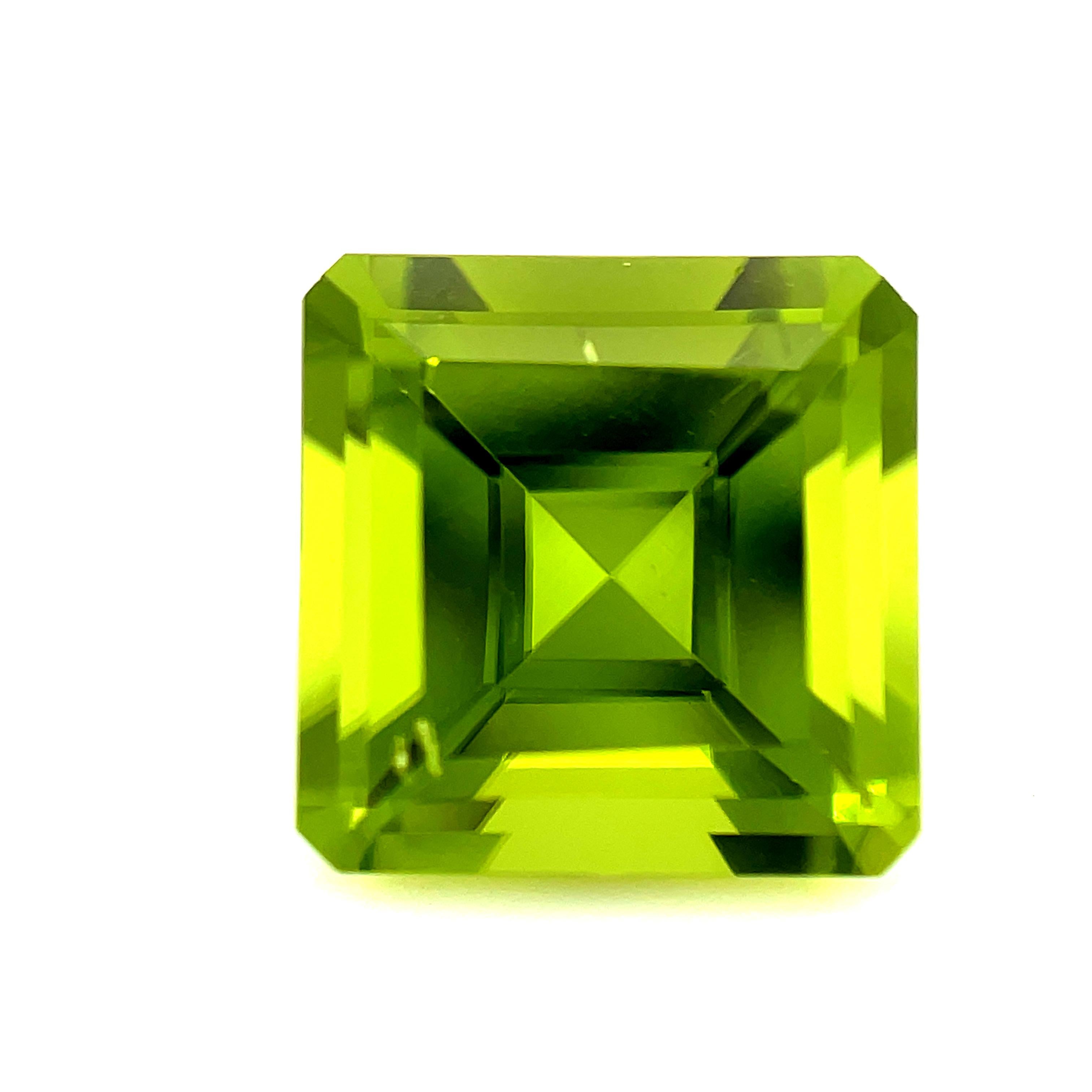This beautifully crystalline peridot has a bright, apple green color and exceptional clarity! It has excellent luster, giving this gem an extraordinary shine and brilliance. It is a very well proportioned square measuring 10.12 x 10.12 x 6.62