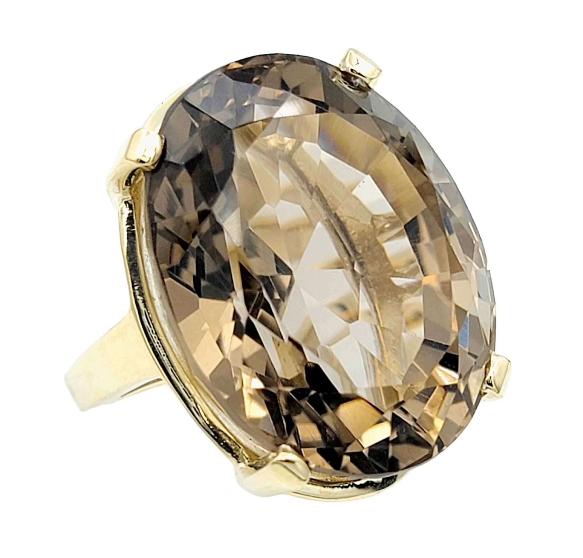 Contemporary 50.71 Carat Oval Cut Smoky Quartz Solitaire 14 Karat Yellow Gold Cocktail Ring For Sale