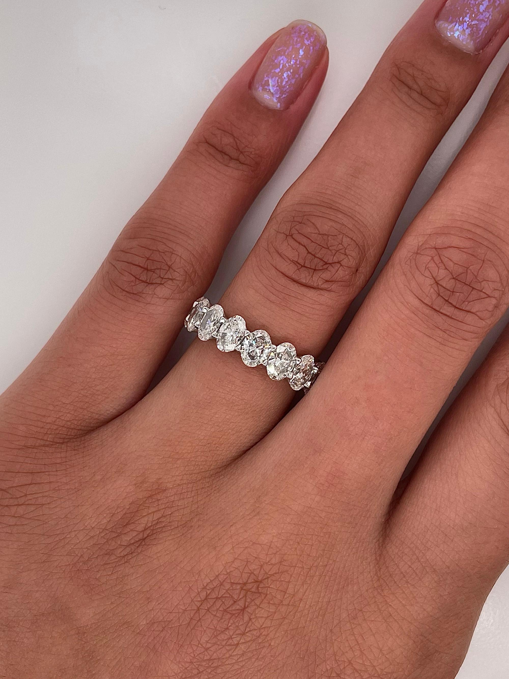 Ladies diamond Eternity band carries a total of 5.07ct of oval cut diamonds placed in platinum.

Size: 6.0
Color: G-H
Clarity: VS1

This shared prong style Eternity band was handmade by our jewelers in New York City 