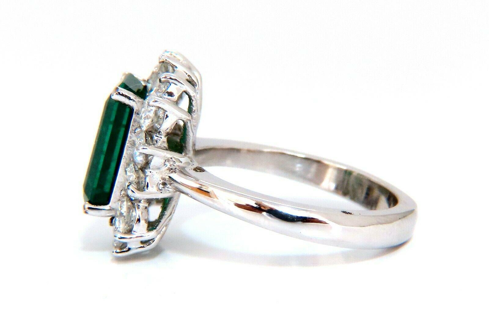 Prime Halo Mod Deco Green.

3.40ct. Natural Emerald Ring

Emerald, Brilliant cut

11.5 x 8.1mm Diameter

Transparent & Vivid Green 

1.67ct. Diamonds.

Round & full cuts 

G-color Vs-2 clarity.  

14kt. white gold

7 grams

Ring Current size: