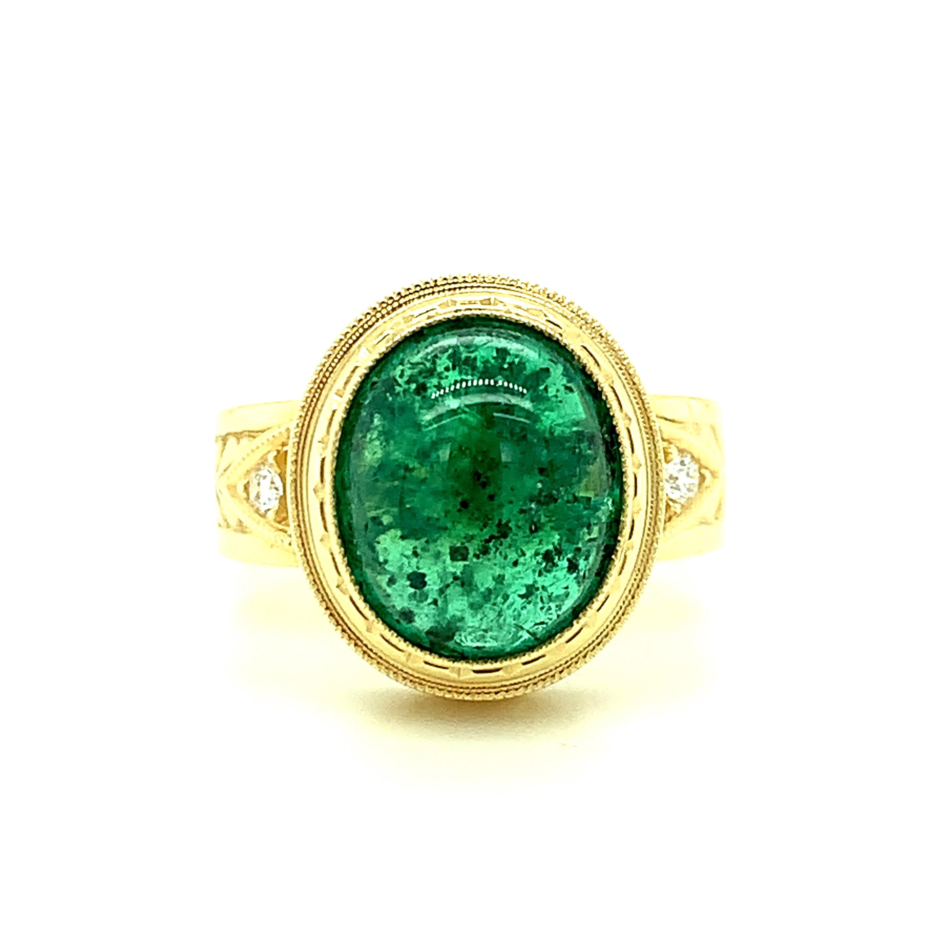 This handsome 18k yellow gold ring is set with a luscious 5.08 carat bright green emerald cabochon in one of our most popular signature designs! Custom made in 18k yellow gold to show off the ideal emerald green color of this pretty gem. The bezel
